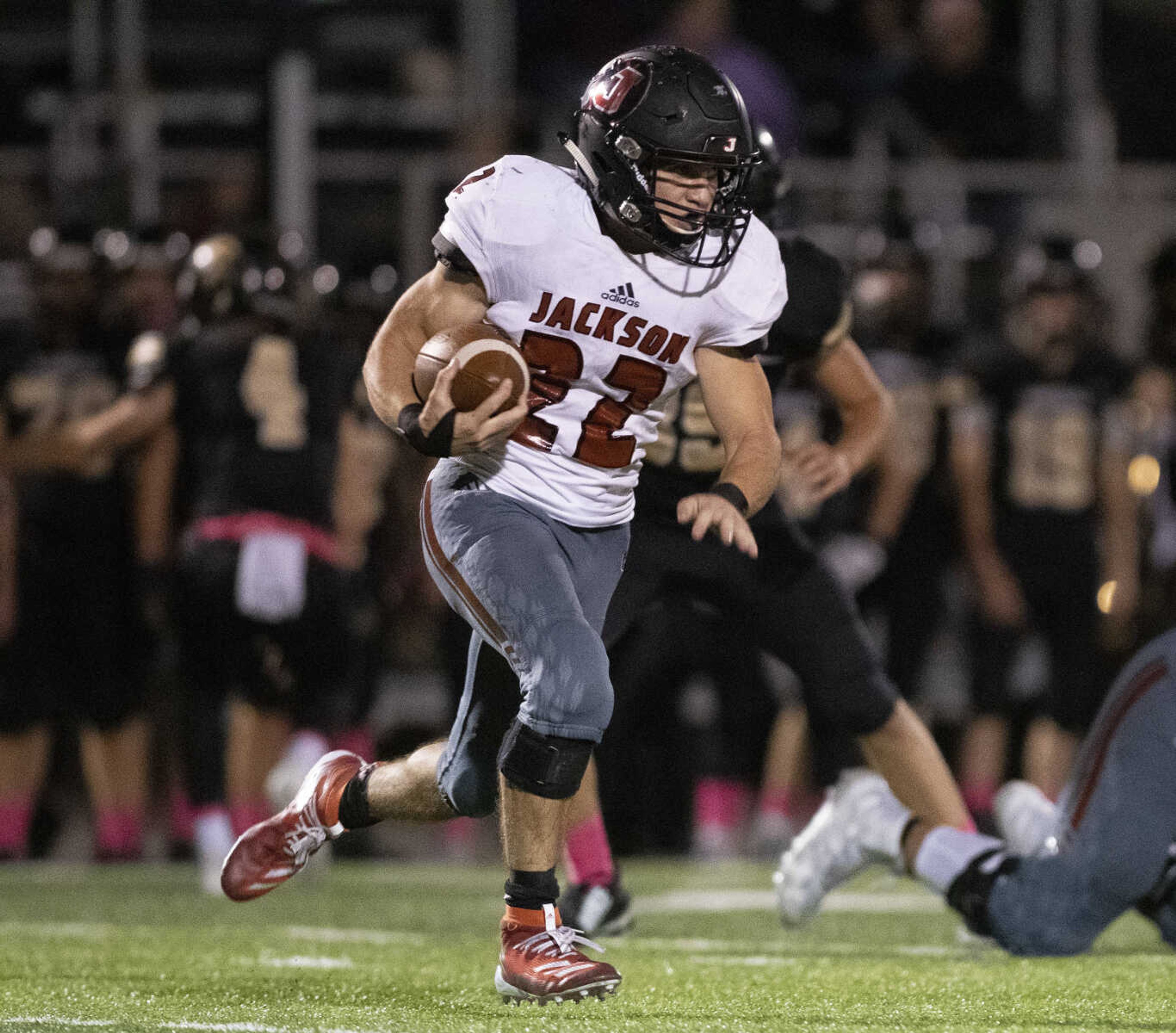 Jackson's Seth Waters (22) handles the ball during the Jackson Indians' 35-14 victory over Farmington on Friday, Oct. 4, 2019, in Farmington, Missouri.