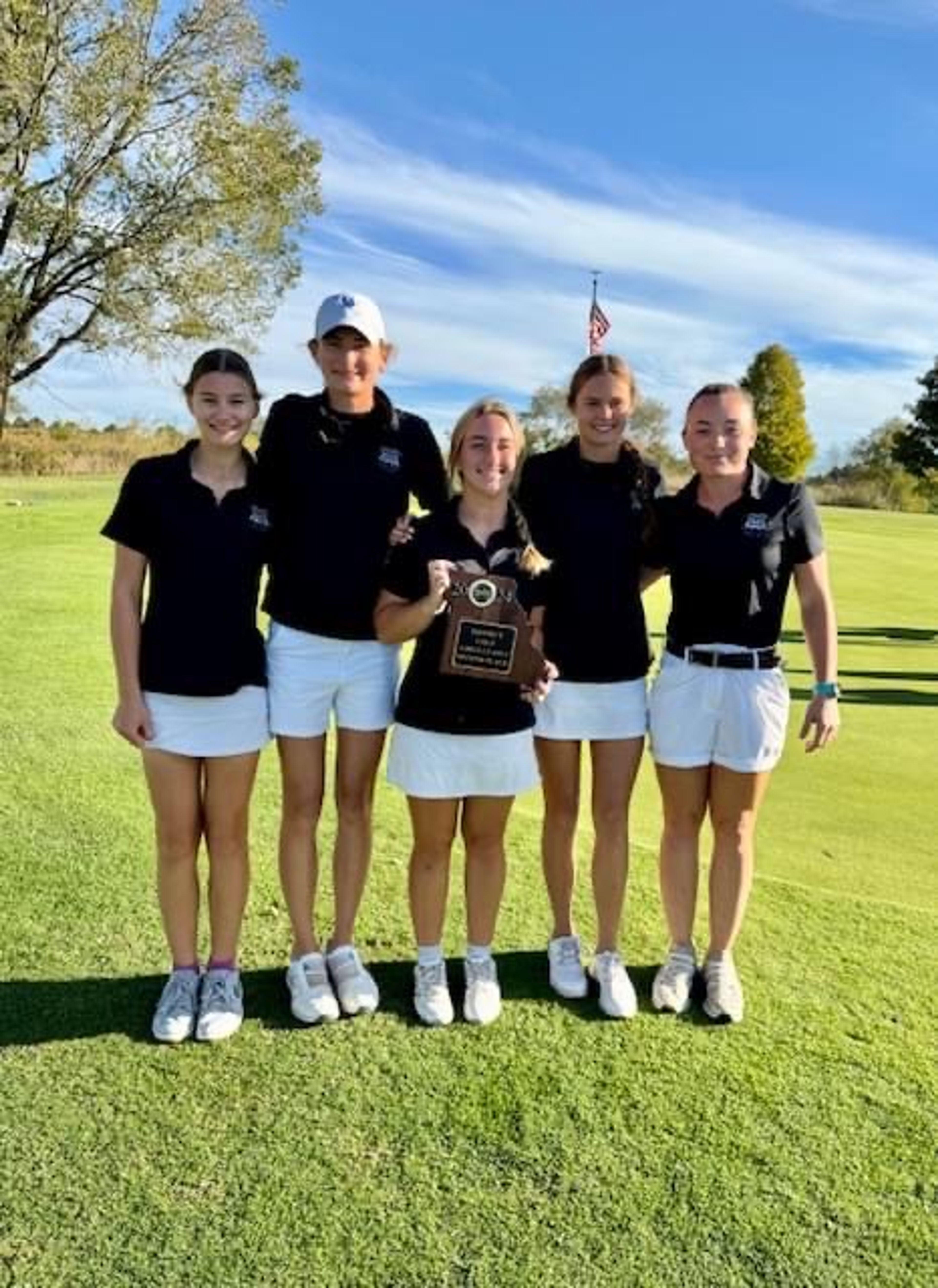 The Notre Dame golf team poses with the Class 2 District 1 second place trophy on Monday at Ste. Genevieve. 