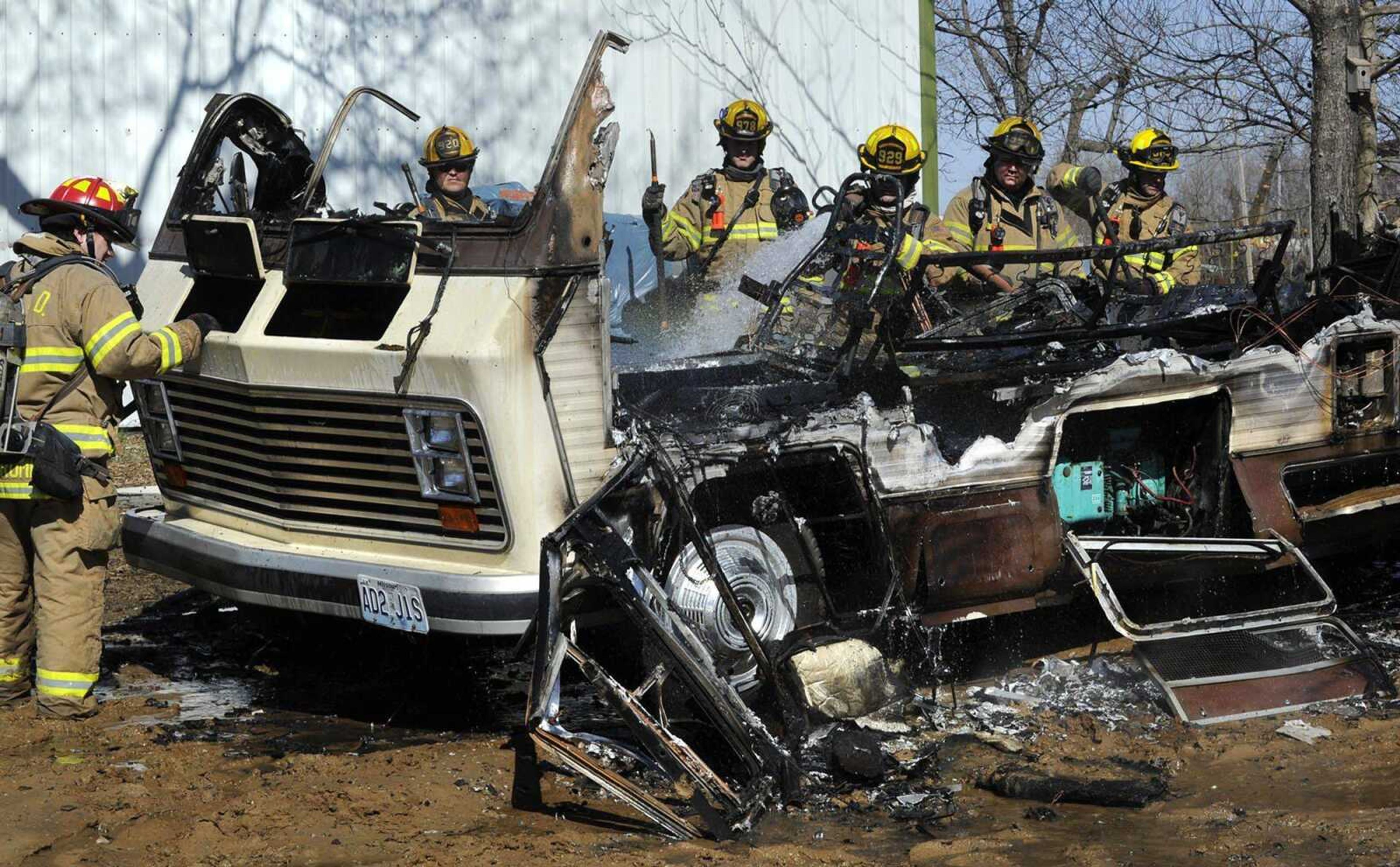 Cape Girardeau firefighters extinguish a fire that destroyed a motor home Sunday afternoon in the 1200 block of North Water Street. (Fred Lynch)