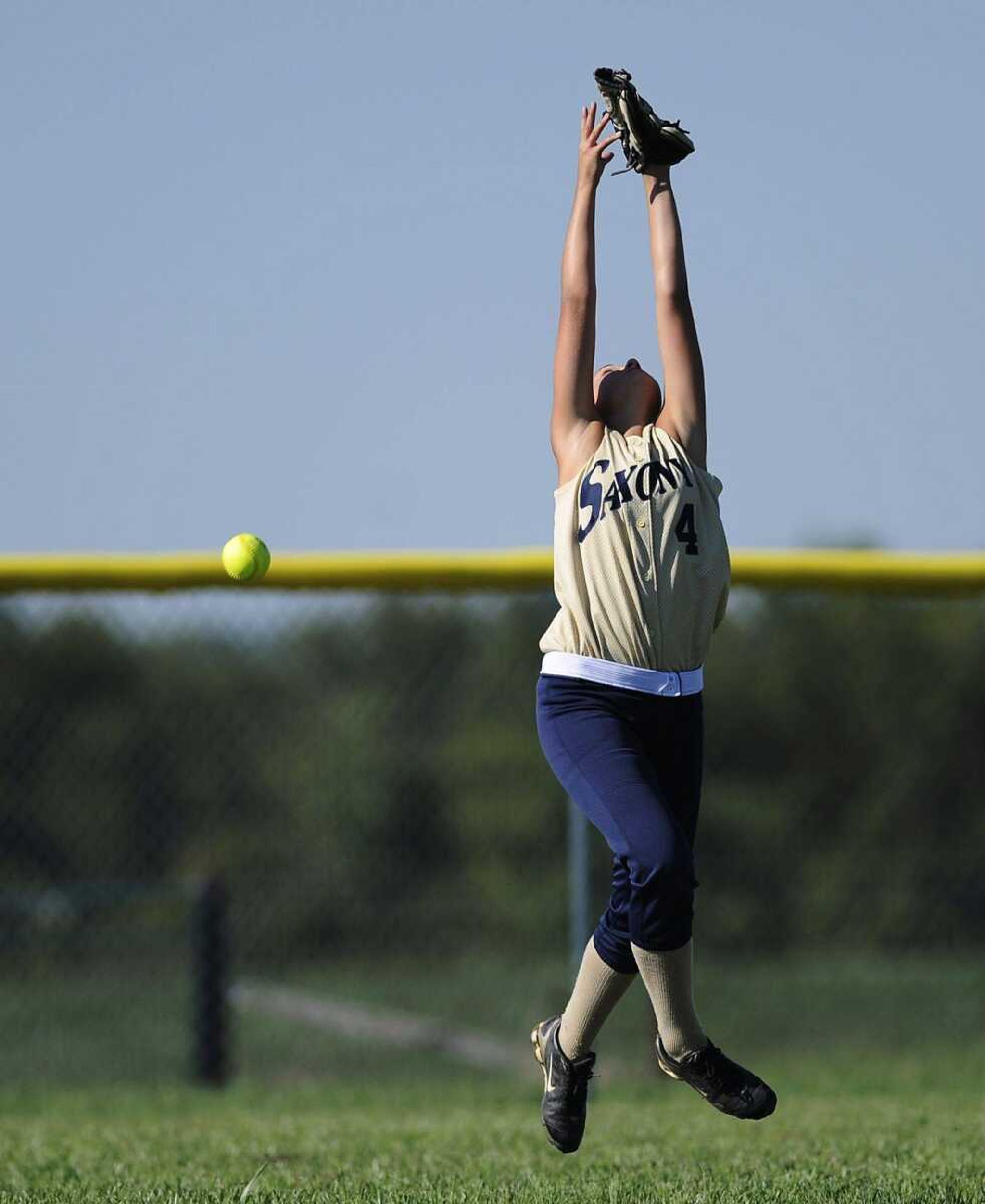 A hit by Chaffee third baseman Julia Sutterfield gets over the head of Saxony Lutheran left fielder Abby Hadler. (ADAM VOGLER)