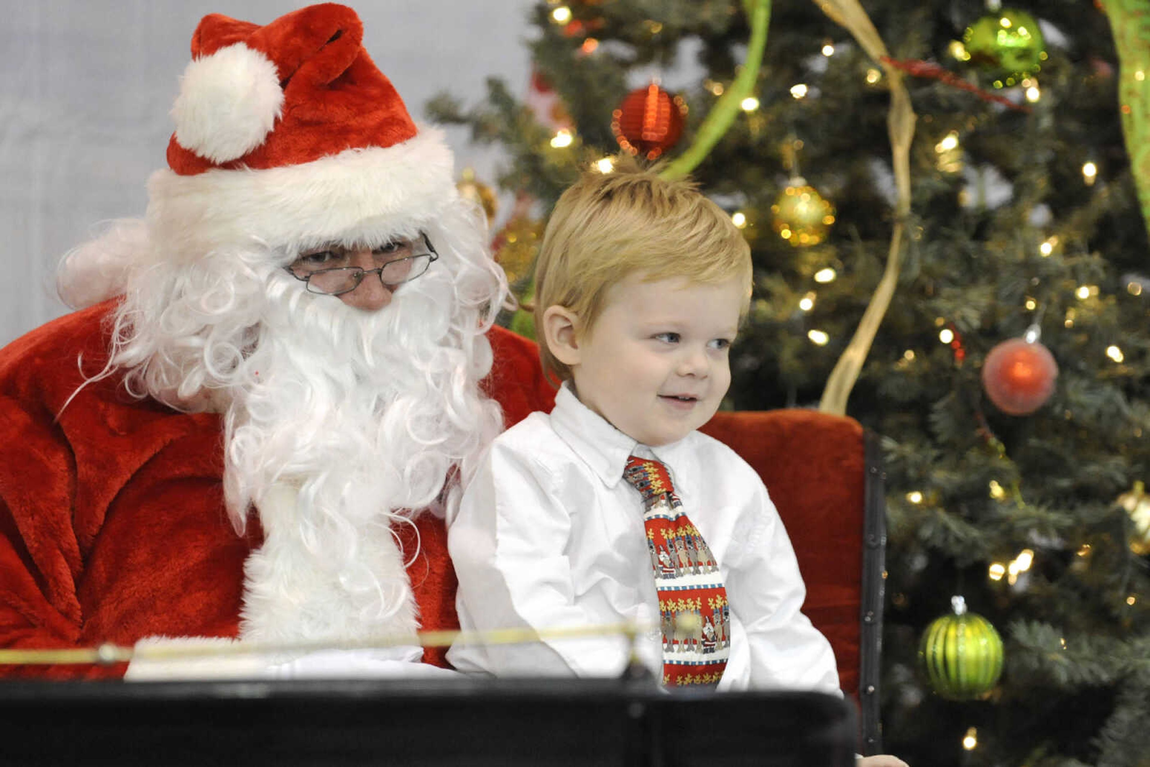 GLENN LANDBERG ~ glandberg@semissourian.com

Kids visit with Santa after a fundraiser breakfast for the Cape Girardeau Parks and Recreation Foundation Saturday, Dec. 13, 2014 at the Osage Centre.