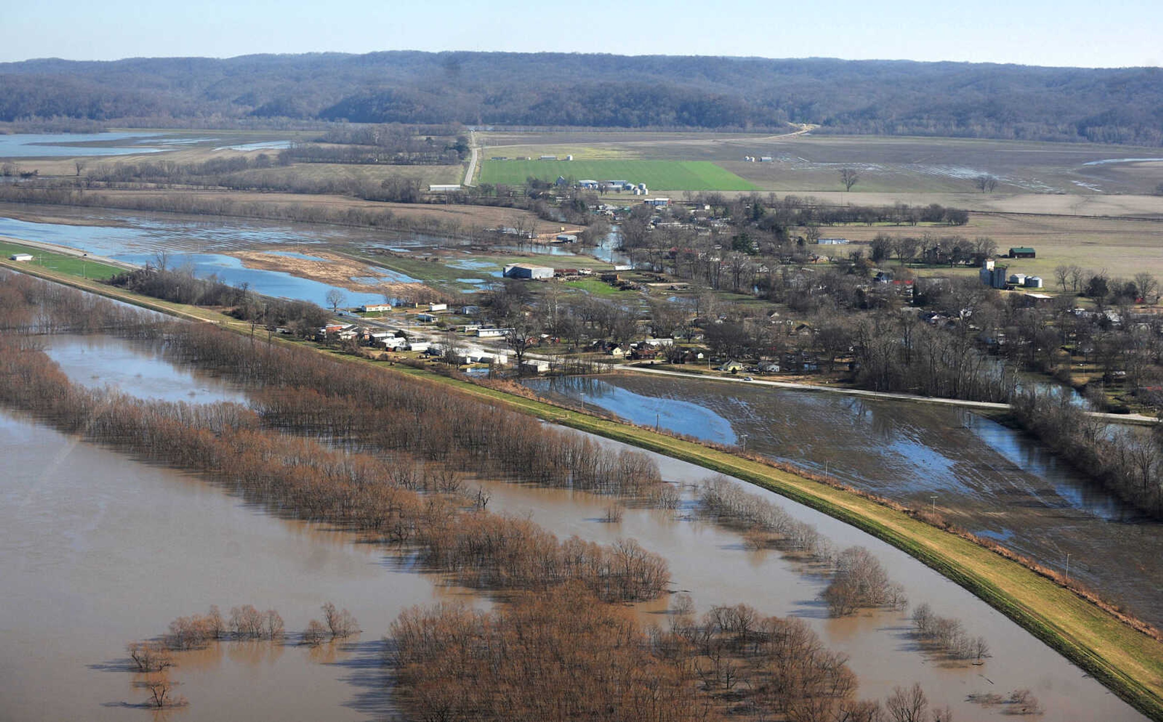 LAURA SIMON ~ lsimon@semissourian.com

Water seeps into portions of McClure, Illinois as the swollen Mississippi River pushes against the levee protecting the Southern Illinois town, Saturday, Jan. 2, 2016.