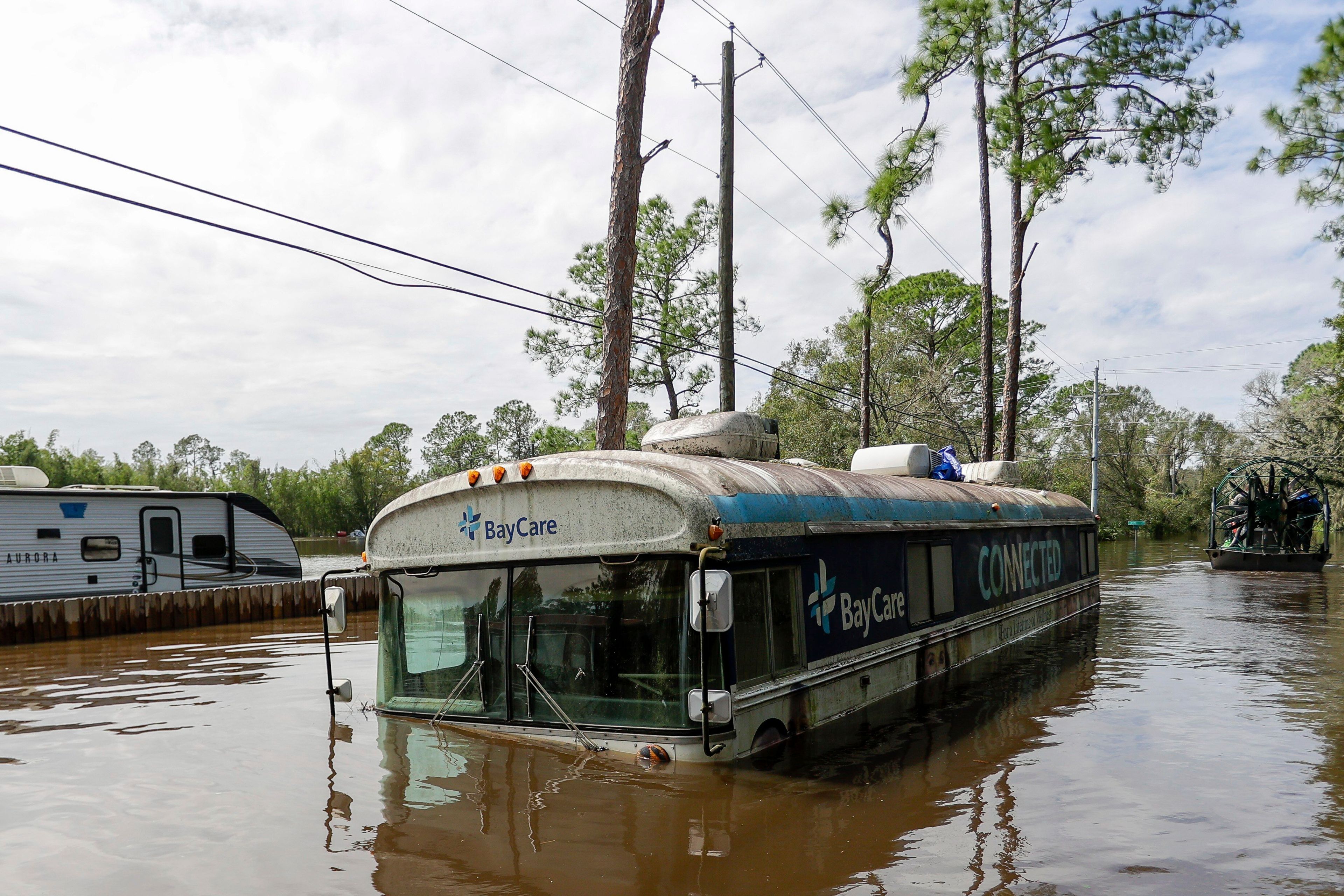 Vehicles and homes in a community inundated by historic flooding of the Alafia River due to Hurricane Milton are seen on Friday, Oct. 11, 2024 in Lithia, Fla. (Luis Santana/Tampa Bay Times via AP)