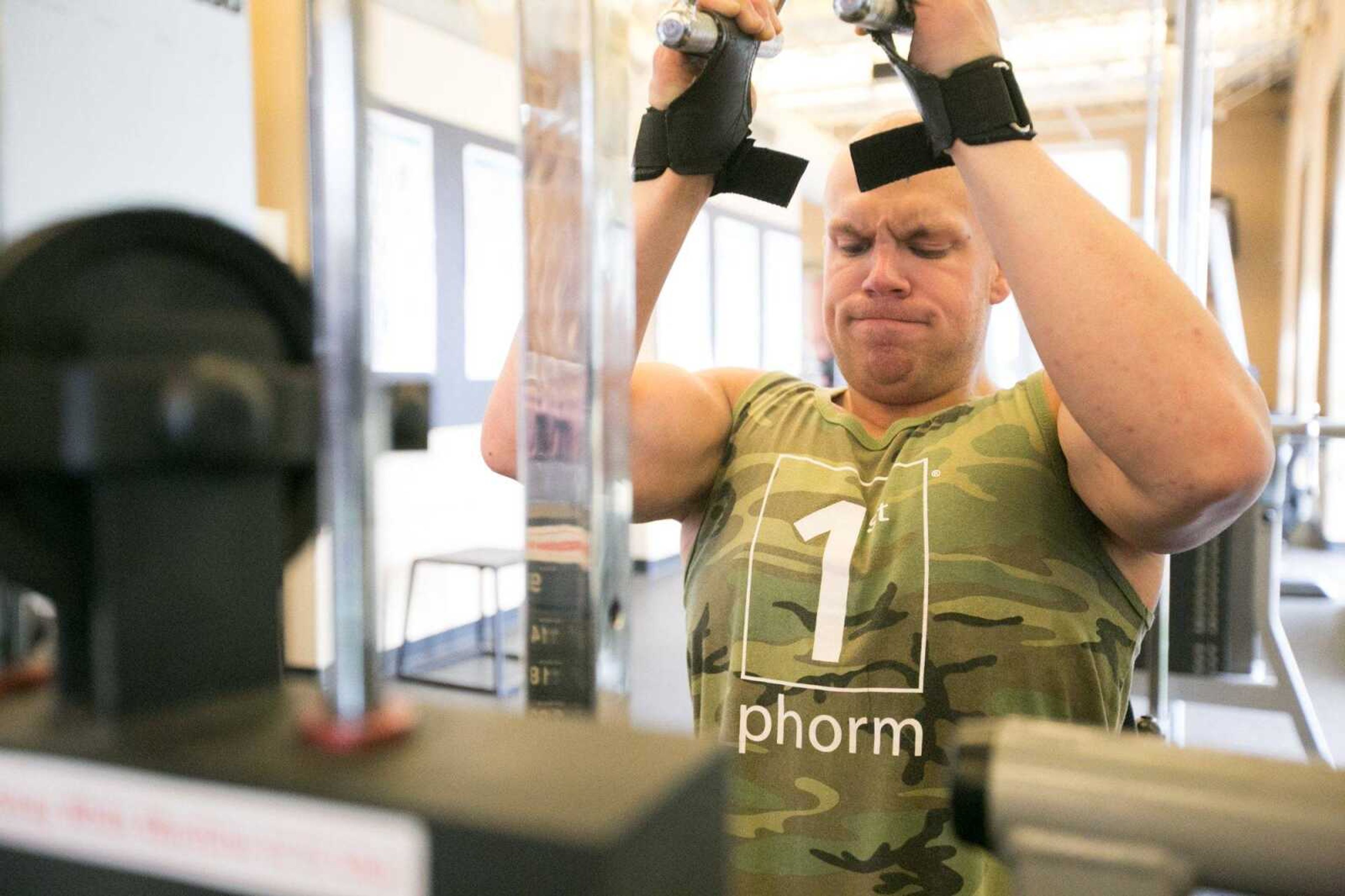 Brandon Strop moves through his workout routine Tuesday at HealthPoint Fitness in Cape Girardeau. (Glenn Landberg)