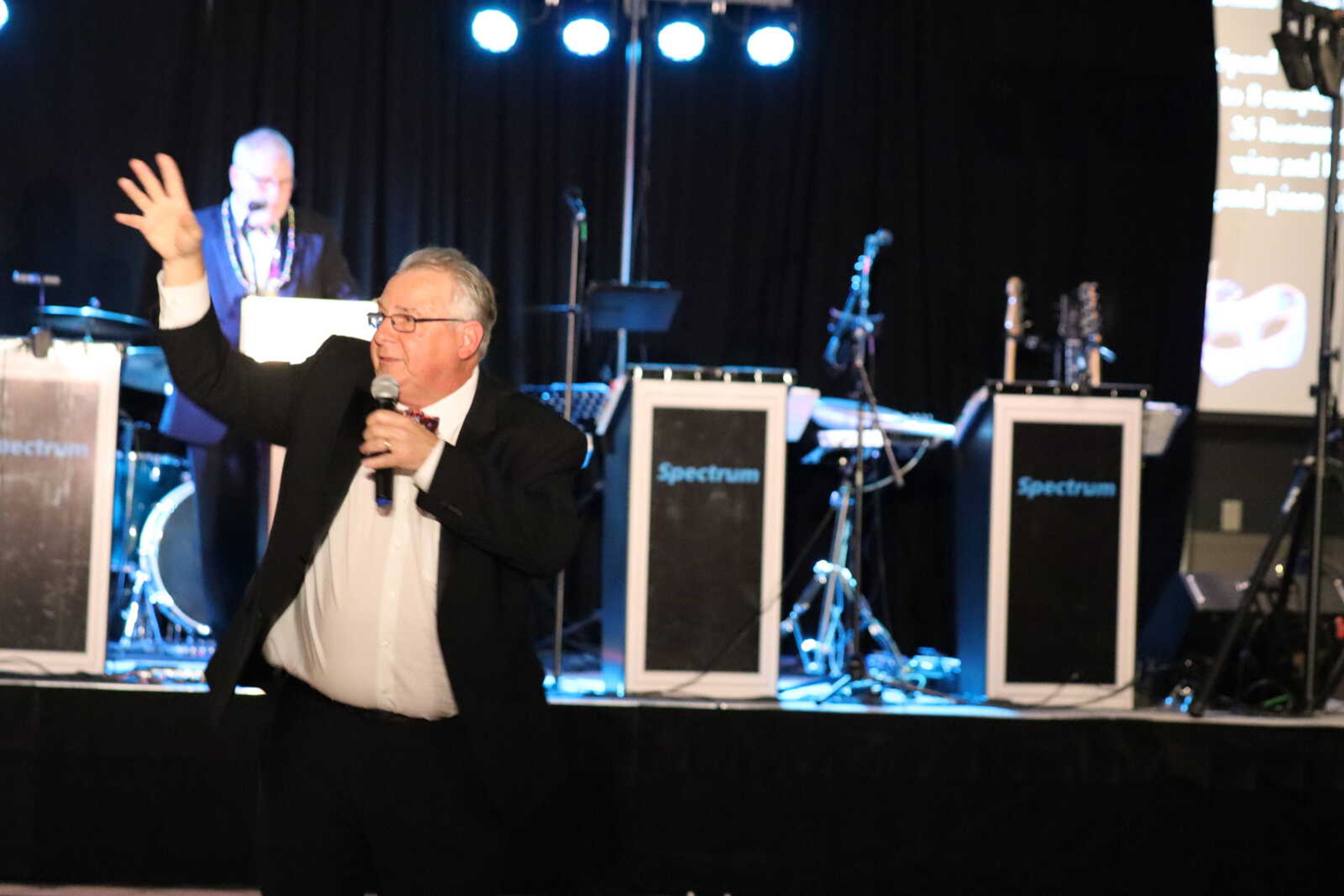 Honorary chair Jim Riley guides the audience through everything thats being auctioned off for the night.