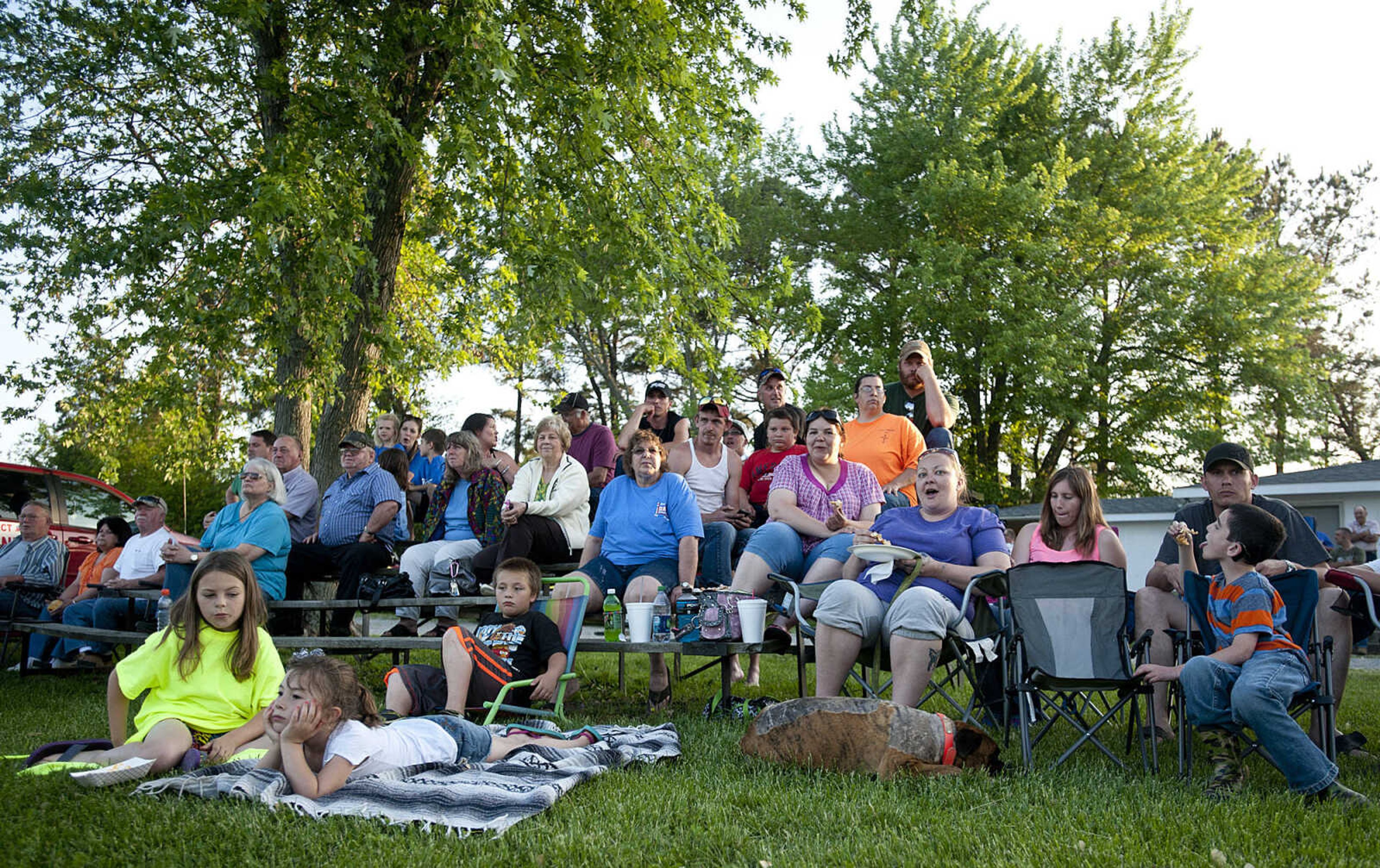 Fans watch the FX Class heat during the Southeast Missouri Lawnmower Racing Association's Racing for a Cure presented by the Patton Lions Club at the Patton Saddle Club Saturday, May 10, in Patton, Mo.