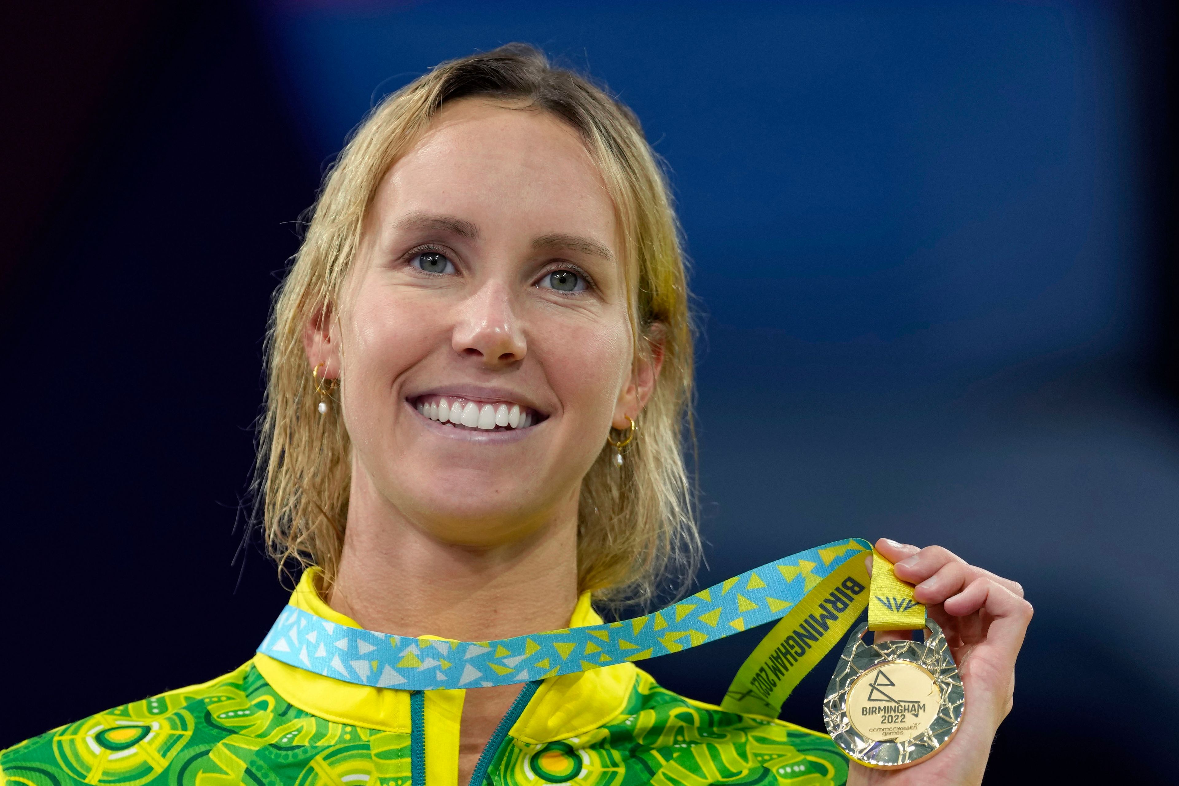 FILE - Emma McKeon of Australia poses after winning the gold medal in the Women's 50 meters butterfly final during the swimming competition of the Commonwealth Games, at the Sandwell Aquatics Centre in Birmingham, England, Monday, Aug. 1, 2022. (AP Photo/Kirsty Wigglesworth, File)