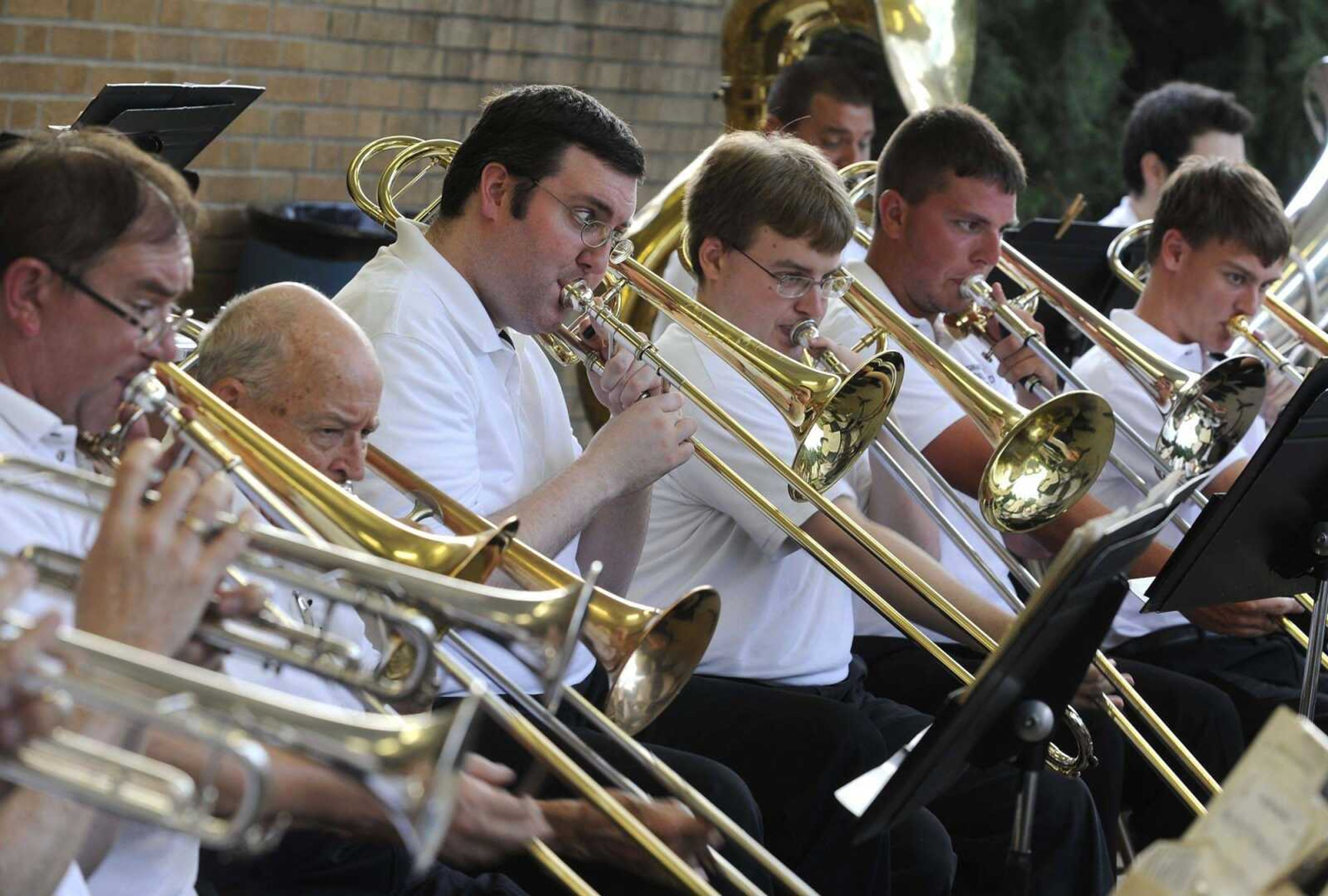 The Cape Girardeau Municipal Band trombone section plays June 18 at the Capaha Park bandshell. (Fred Lynch)