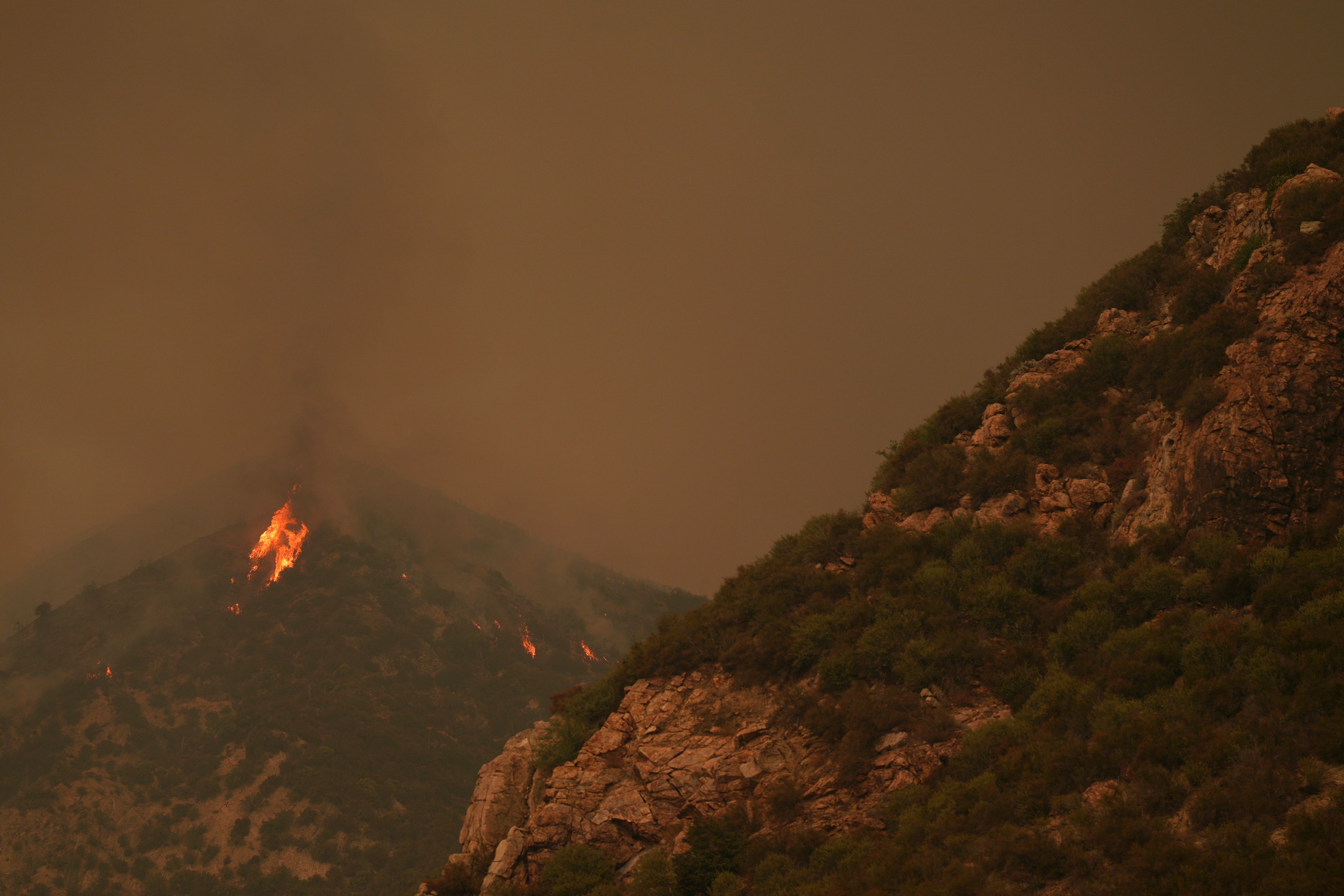 The Line Fire burns in the mountains Monday, Sept. 9, 2024, near Forest Falls, Calif. (AP Photo/Eric Thayer)