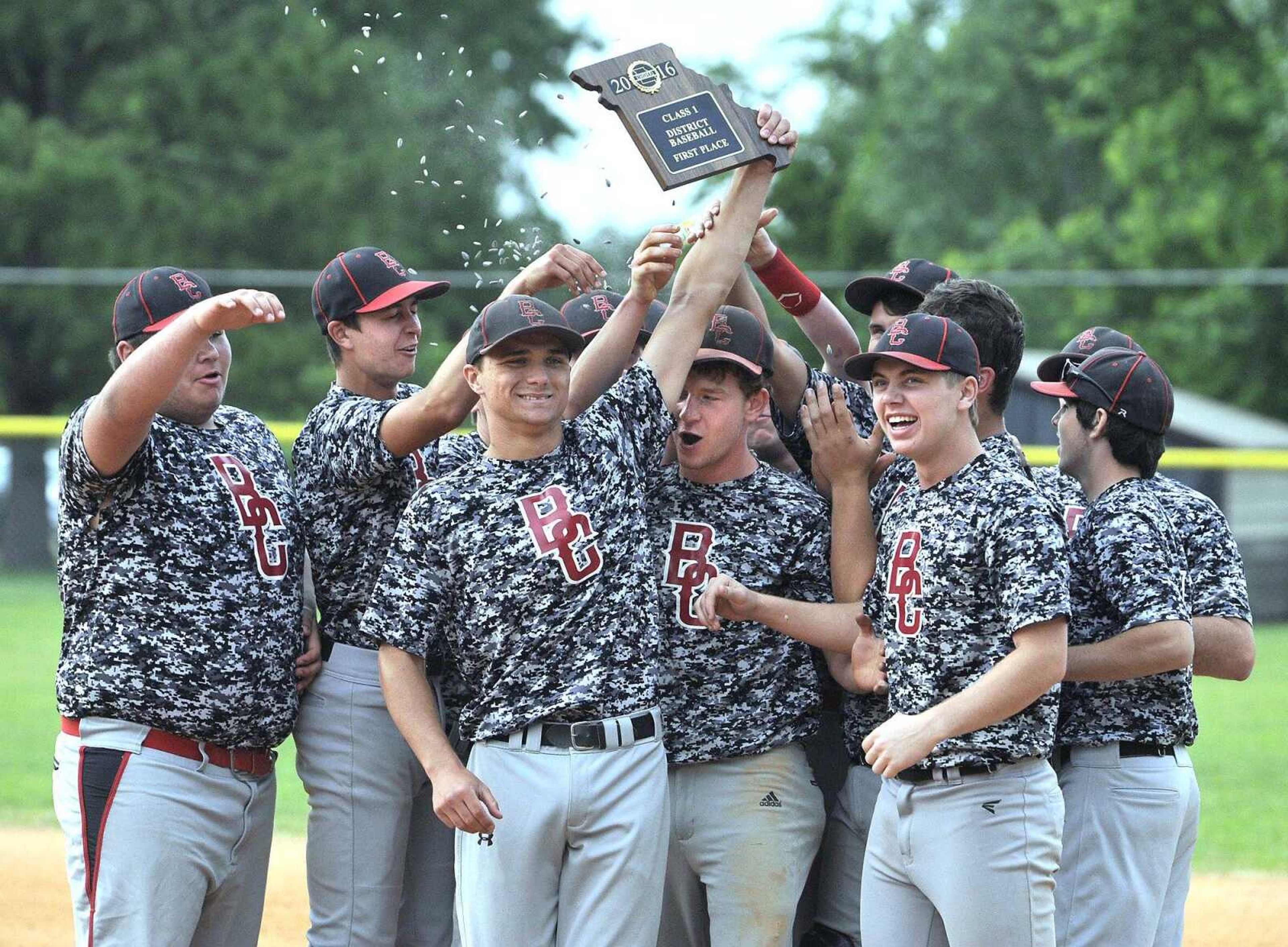 Bell City players celebrate with the first-place plaque after defeating Oran in the Class 1 District 2 championship  game Thursday in Advance, Missouri. The Cubs won 4-1.