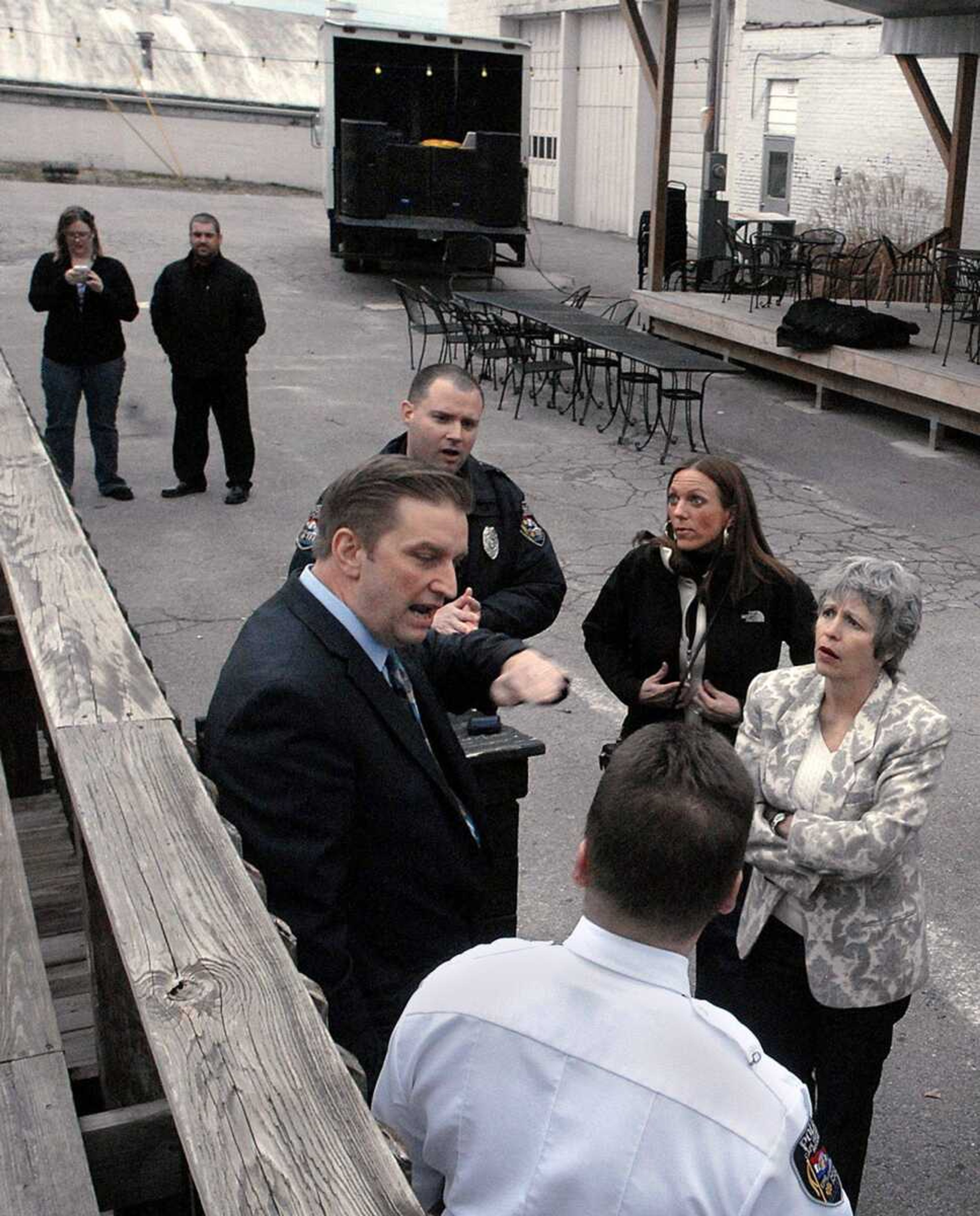 Cape Girardeau City Manager Scott Meyer, left, goes over the noise demonstration Wednesday, March 9, 2011 at Bel Air Grill in downtown Cape Girardeau with patrolman Richard Couch, Cape Girardeau City Council members Meg Davis Proffer and Debra Tracey, and Lt. Rick Price. A truck loaded with speakers totaling 5000 watts was used for the noise demonstration. (Laura Simon)