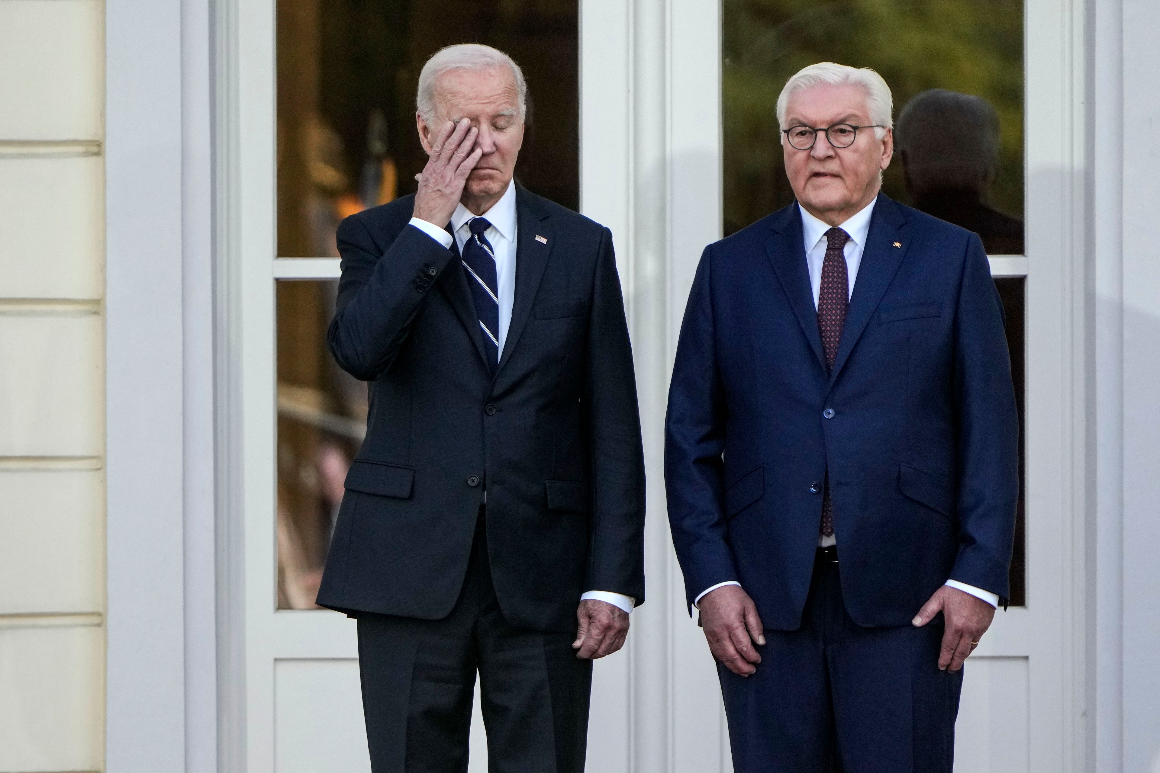 President Joe Biden stands beside German President Frank-Walter Steinmeier before they inspect the military honour guard during the welcoming ceremony at Bellevue Palace in Berlin, Germany, Friday, Oct. 18, 2024. (AP Photo/Matthias Schrader)