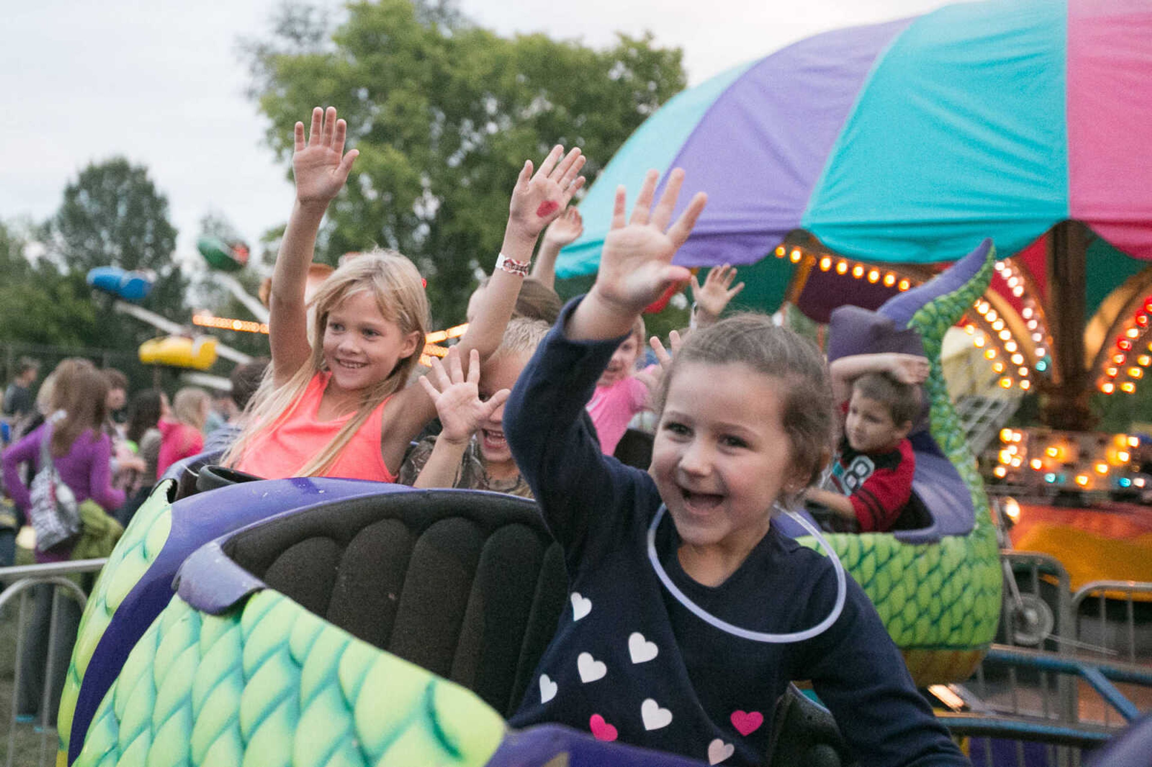 GLENN LANDBERG ~ glandberg@semissourian.com

Hailey Geringer, right, rides a roller coaster at the East Perry Community Fair Saturday, Sept. 26, 2015 in Altenburg, Missouri.