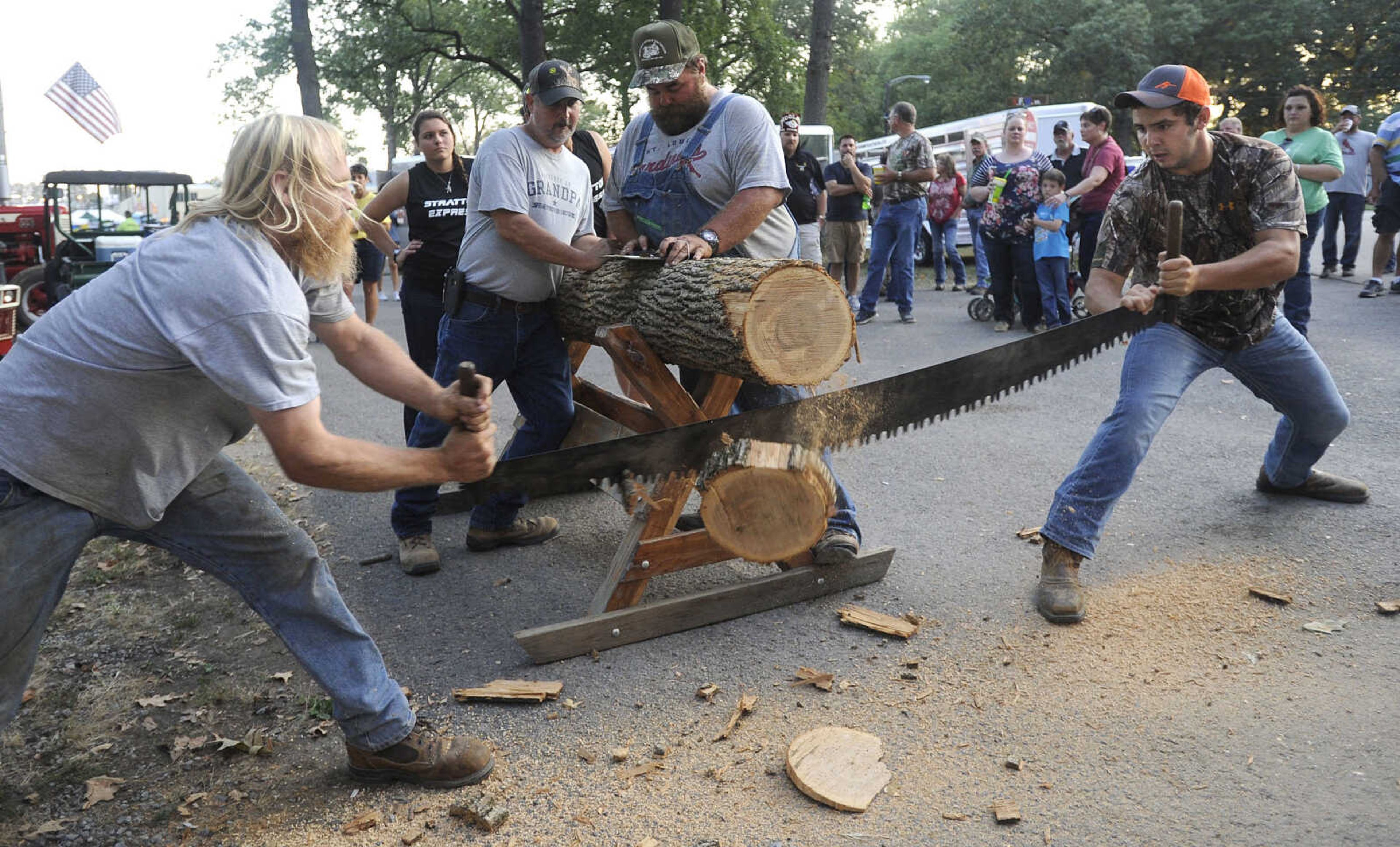 FRED LYNCH ~ flynch@semissourian.com
Eric Mayberry, left, and Gavin Brown complete their cross-cut saw attempt Friday, Sept. 15, 2017 at the SEMO District Fair in Cape Girardeau. The team placed second with a cut in 32.4 seconds.