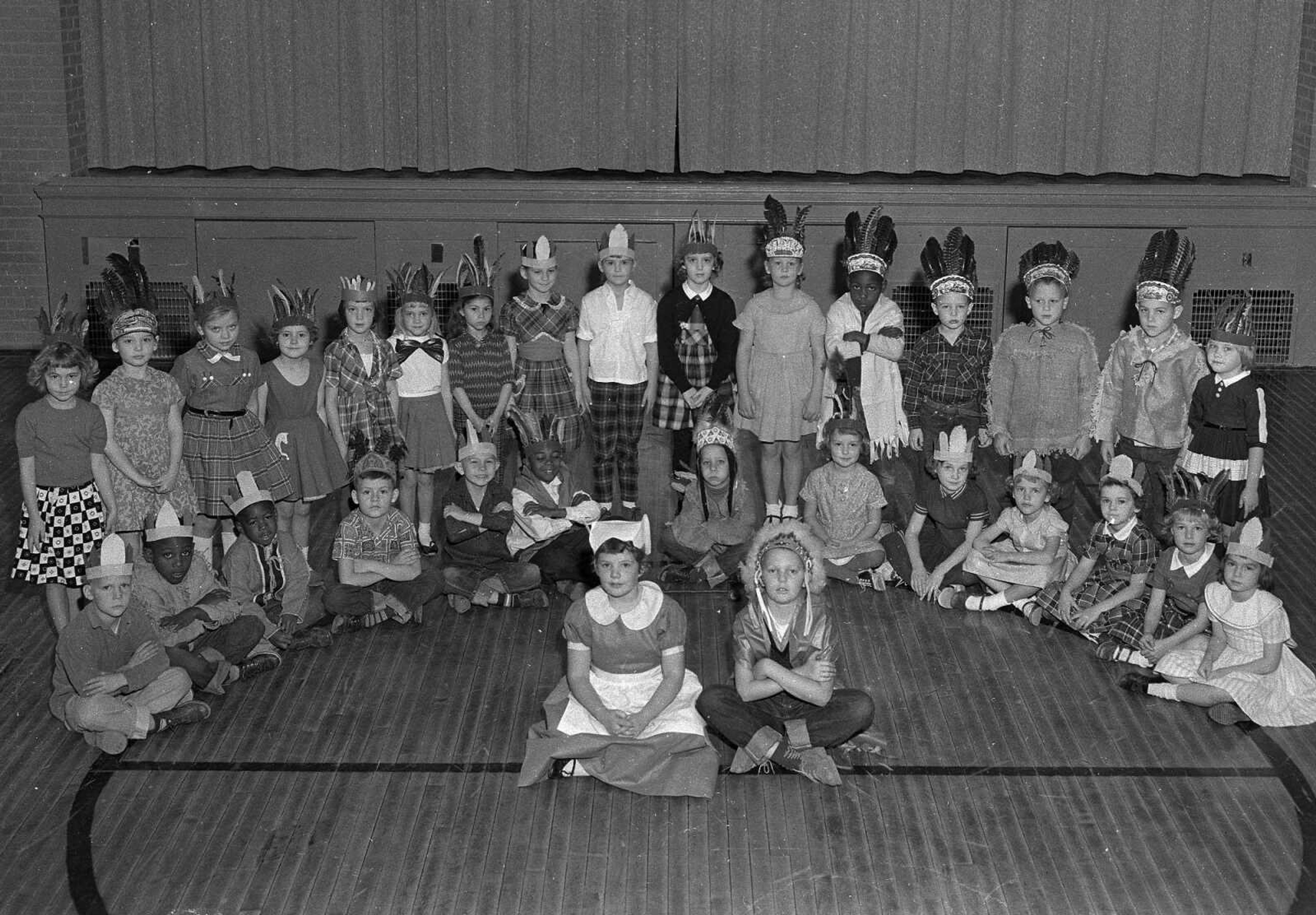 Published Nov. 25, 1959, Southeast Missourian.
These first grade music pupils of Miss Clara Juden at Washington School presented a program as part of a Thanksgiving assembly of all pupils Tuesday at the school. Dressed as Indians and Pilgrims, the group formed the timely setting. From the left, standing: Winona Mullenax, Lynn Fultz, Debra Depro, Ann Bridges, Lucille Hirsch, Cynthia Collie, Paula Cobb, Debra Basler, Kathy Diebold, Lanna Farrow, Terry Taylor, Herbert Daniels, Roger Gibson, David Dow, Bill Carroll and Debra Gerhardt. Seated: Lloyd Ervin, Larry Swan, Don Wilson, Edwin Cardin, Richard York, Ray Moseley, Randy Heise, Connie Devenport, Jean Culbertson, Brenda Mullens, Martha Fulton, Letricia Lueders and Brenda Pender. In front are Lucy Gray and Jeff Hudson. Absent was David Sander. (G.D. Fronabarger ~ Southeast Missourian archive)