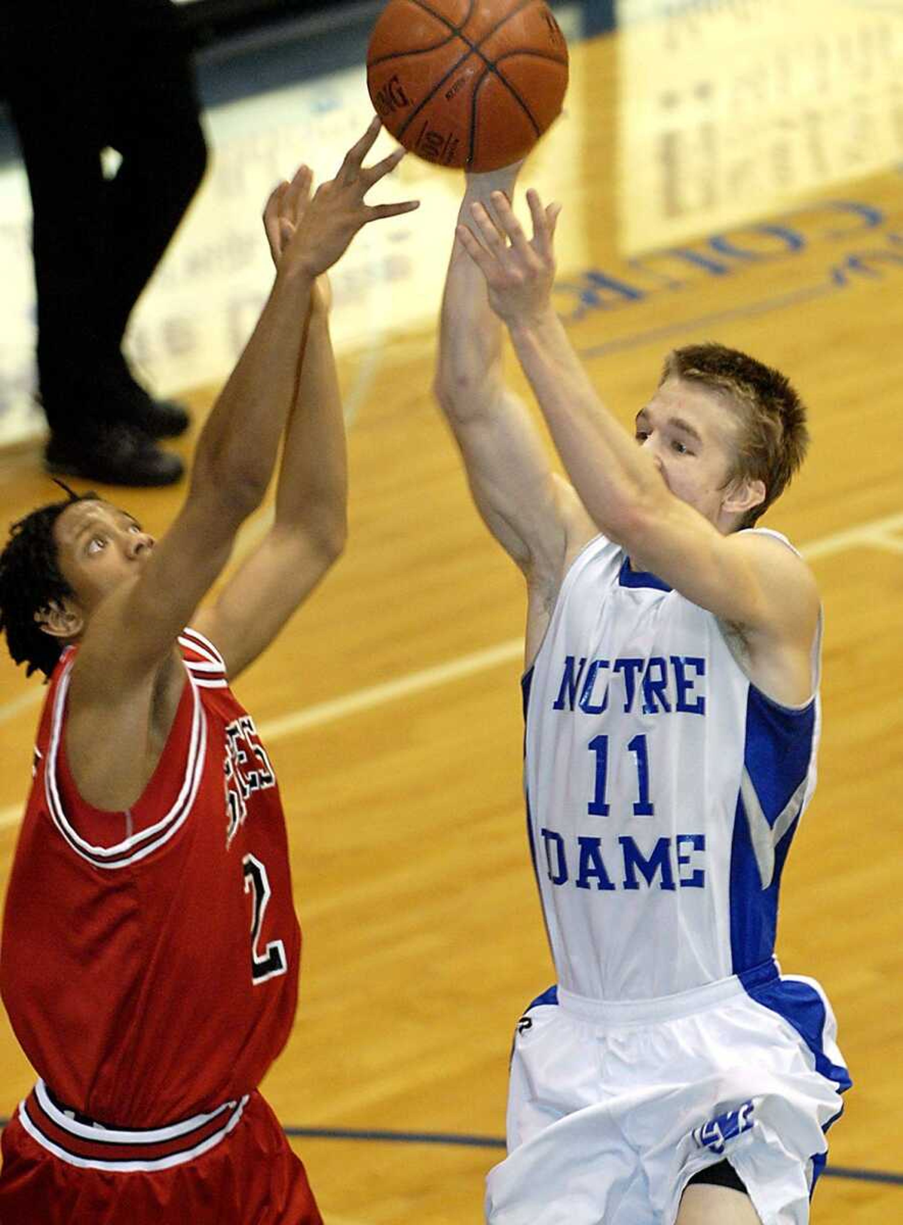 Sikeston senior Sherwin Jones, left, tried to block a shot by Notre Dame's Ty Williams on Friday night at Notre Dame. (Kit Doyle)