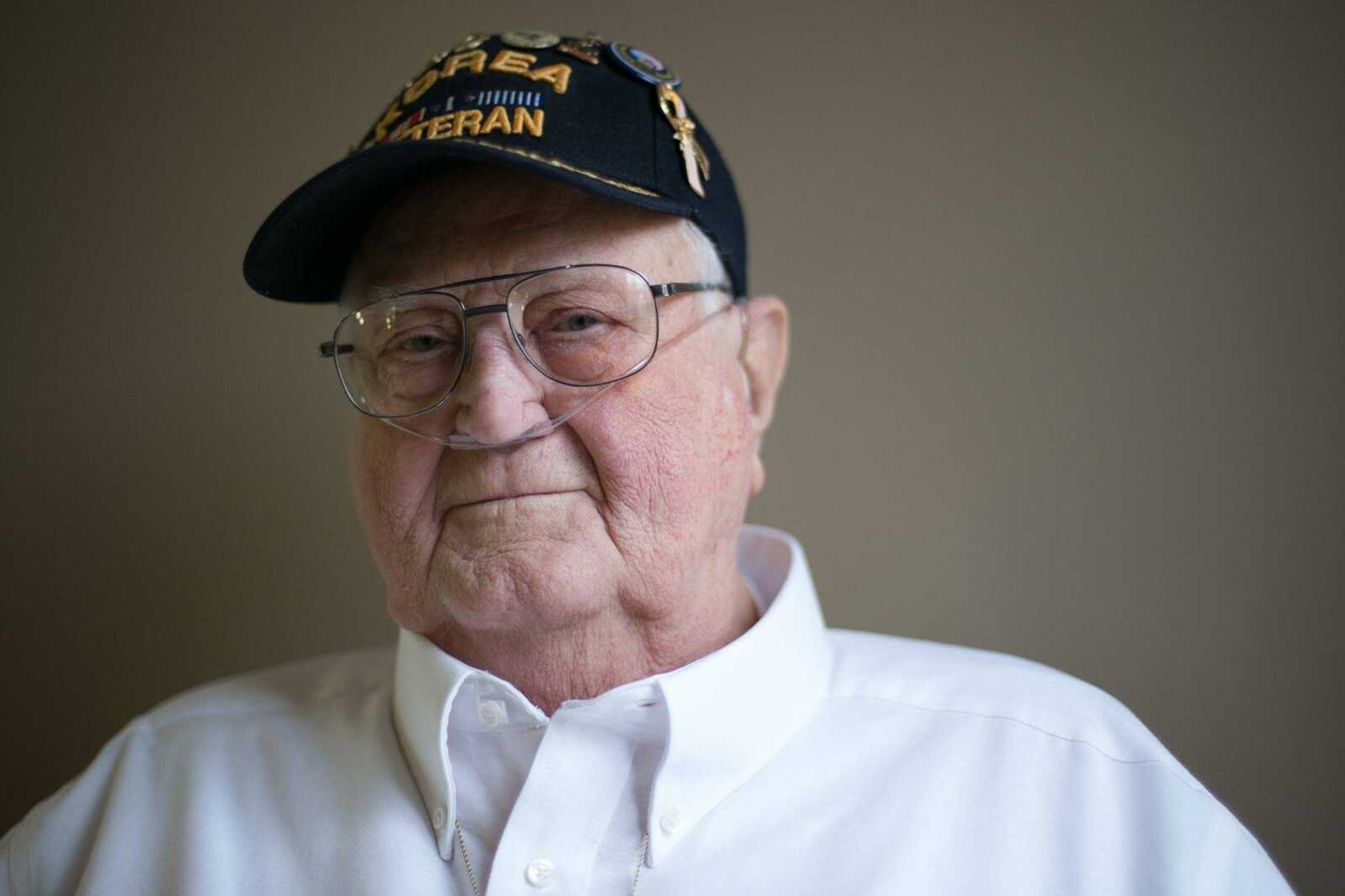 Raymond Burbach poses for a photo Wednesday after being presented with seven awards and accolades for his service in the Korean War by U.S. Rep. Jason Smith at the Missouri Veterans Home in Cape Girardeau.