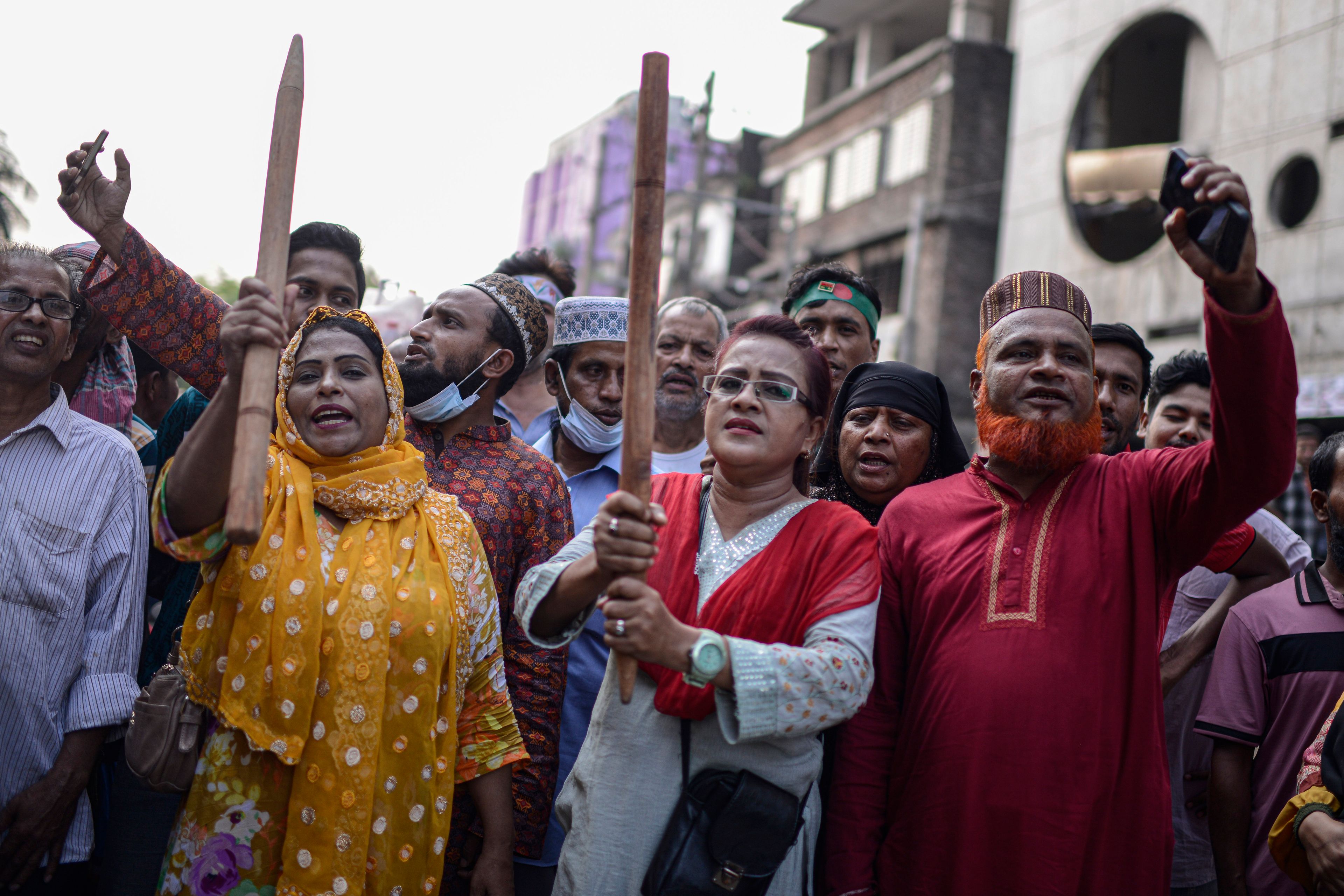 Bangladesh Nationalist Party activists shout slogans during a protest to counter former prime minister Sheikh Hassan's Awami League party rally in Dhaka, Bangladesh, Sunday, Nov. 10, 2024. (AP Photo/Mahmud Hossain Opu)