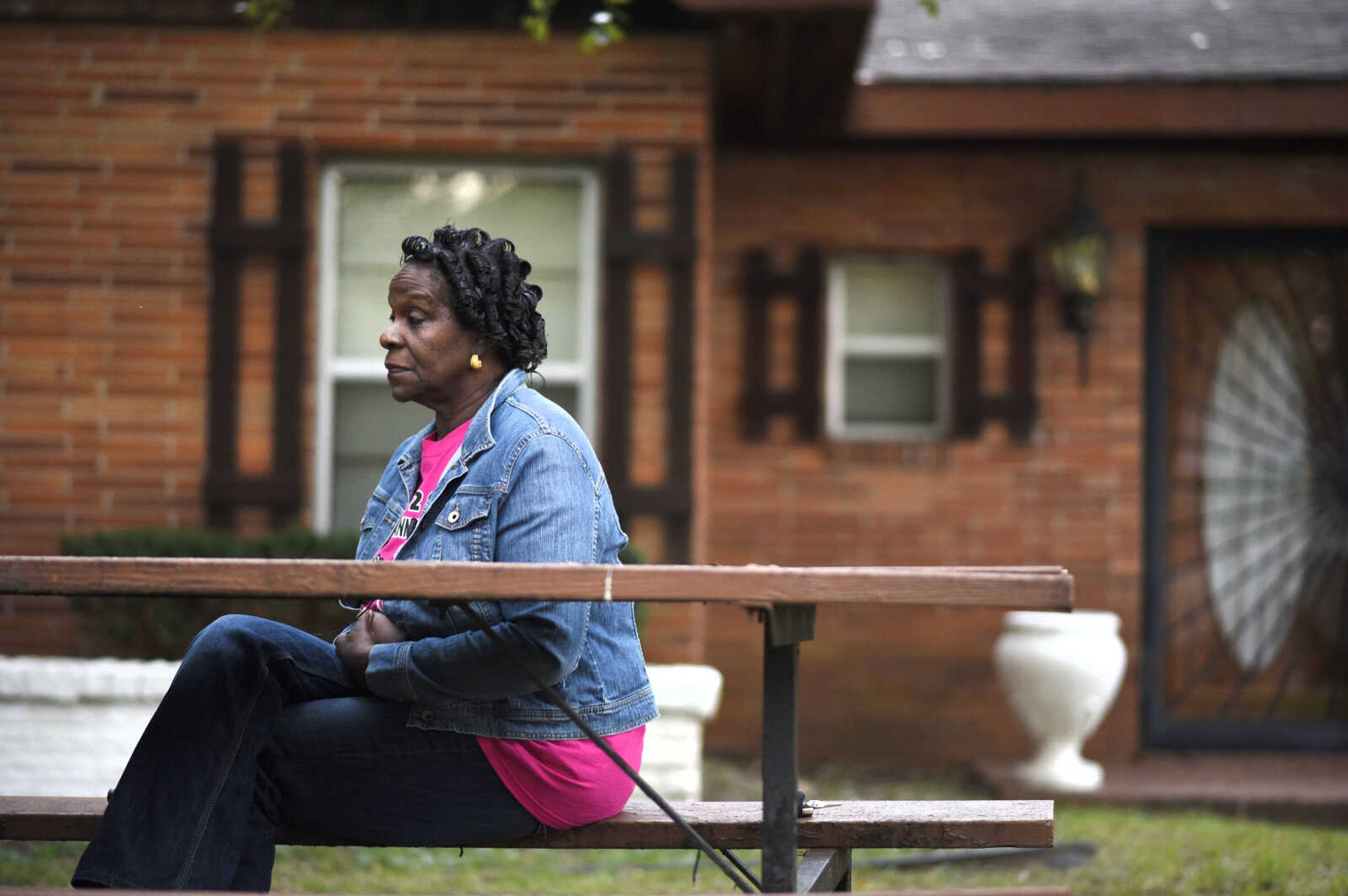 LAURA SIMON ~ lsimon@semissourian.com

Gloria Faye Marshall sits on the picnic table outside the house at 333 Dixie Street in Sikeston, Missouri in September. Marshall was at the house for a fish fry on the night of Aug. 5, 2000.