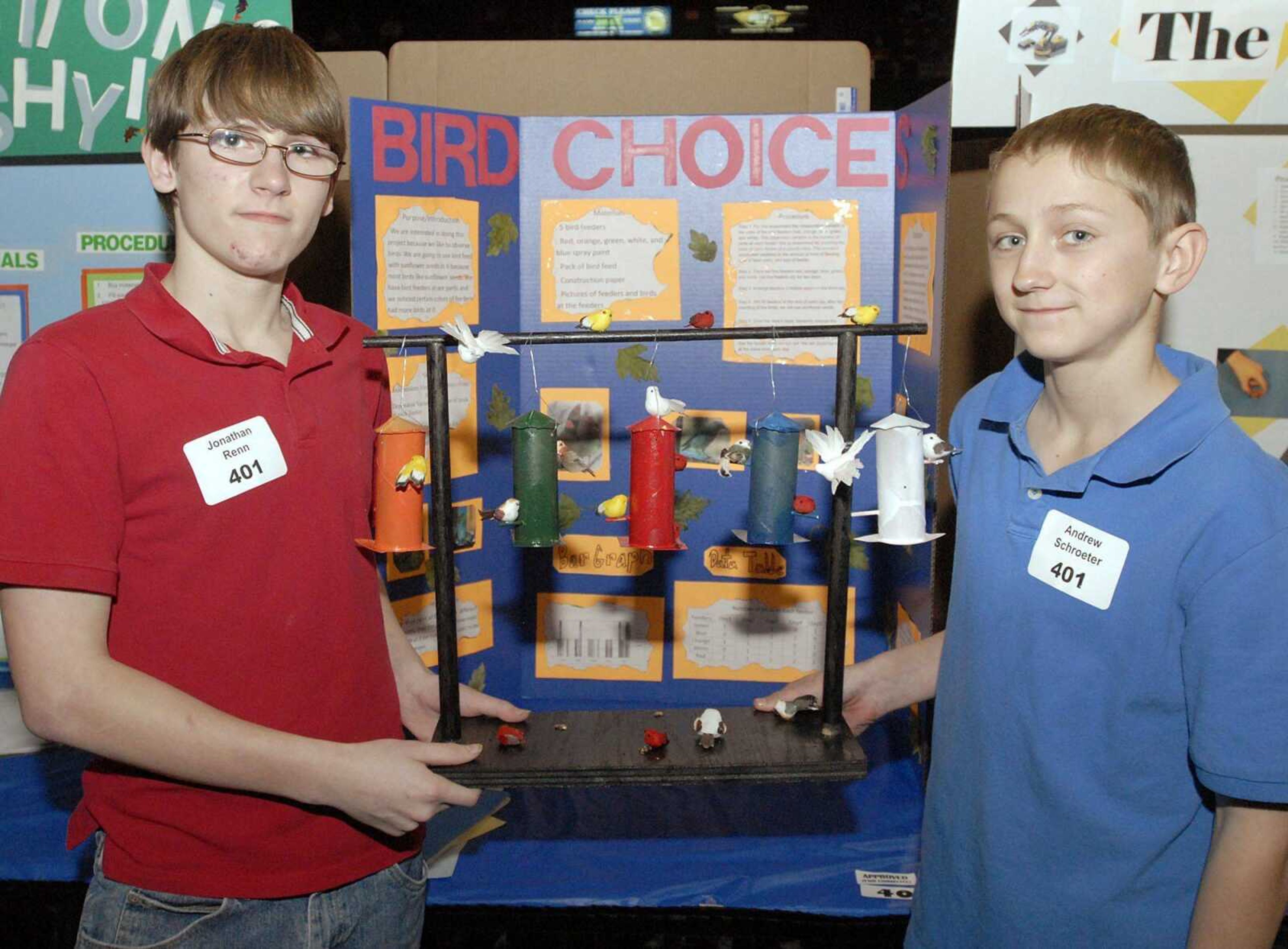 Scott City eighth-graders Jonathan Renn, left, and Andrew Schroeter with their "Bird Choices" science fair project Tuesday at the Show Me Center in Cape Girardeau. (Laura Simon)