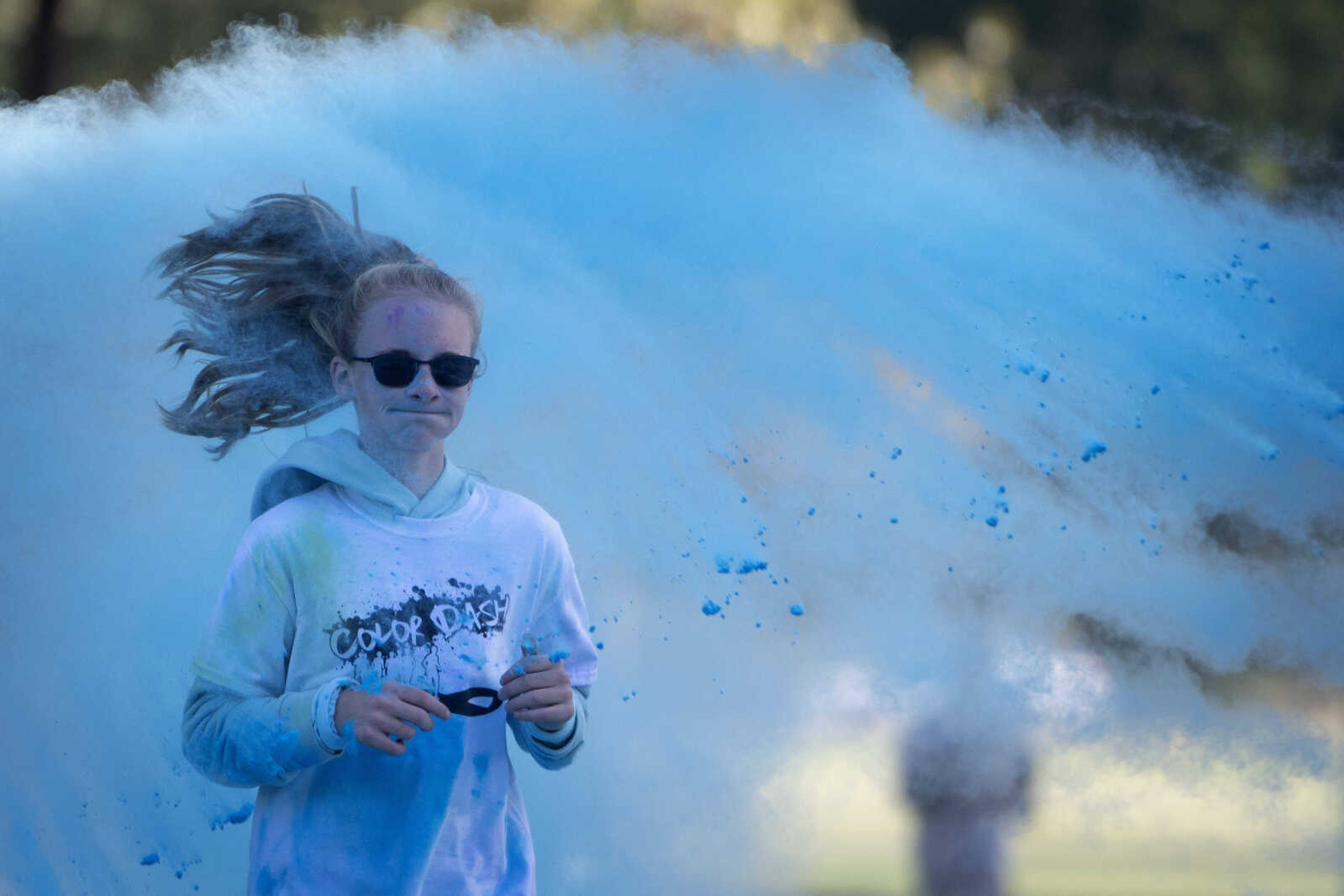 Kateryna Elefson, 12, of Jackson, gets covered in blue coloring at the Saint Francis Foundation's first Color Dash on Saturday, Oct. 12, 2019, at Arena Park in Cape Girardeau.