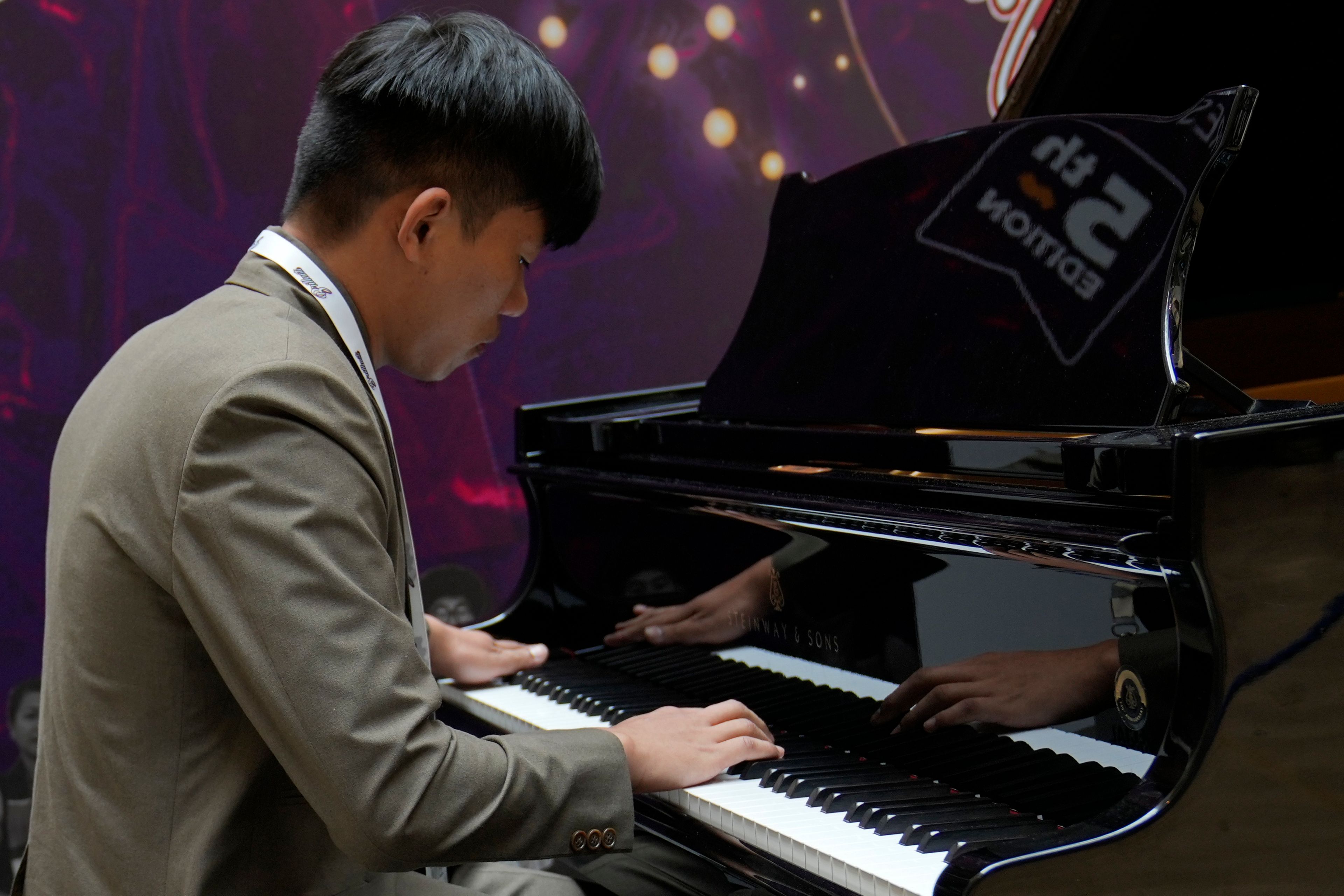 Takosangba Jamir, 27, a blind pianist, performs during the two-day Brillante Piano Festival in Bengaluru, India, Sunday, Sept. 29, 2024. (AP Photo/Aijaz Rahi)