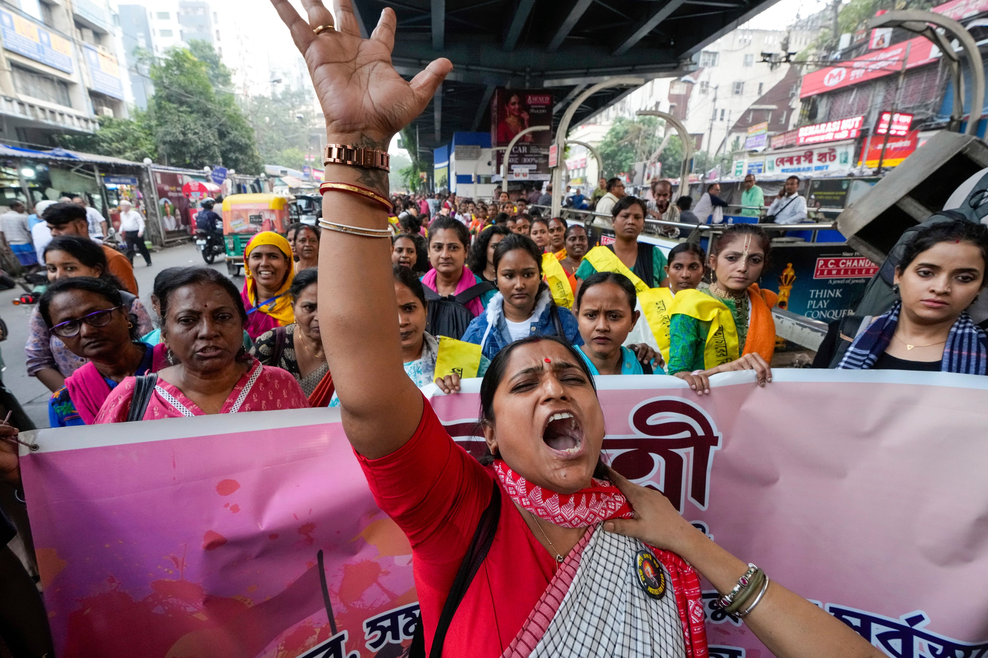 An activist shouts slogan as she leads a rally to mark the International Day for the Elimination of Violence against Women, in Kolkata, India, Monday, Nov. 25, 2024. (AP Photo/Bikas Das)