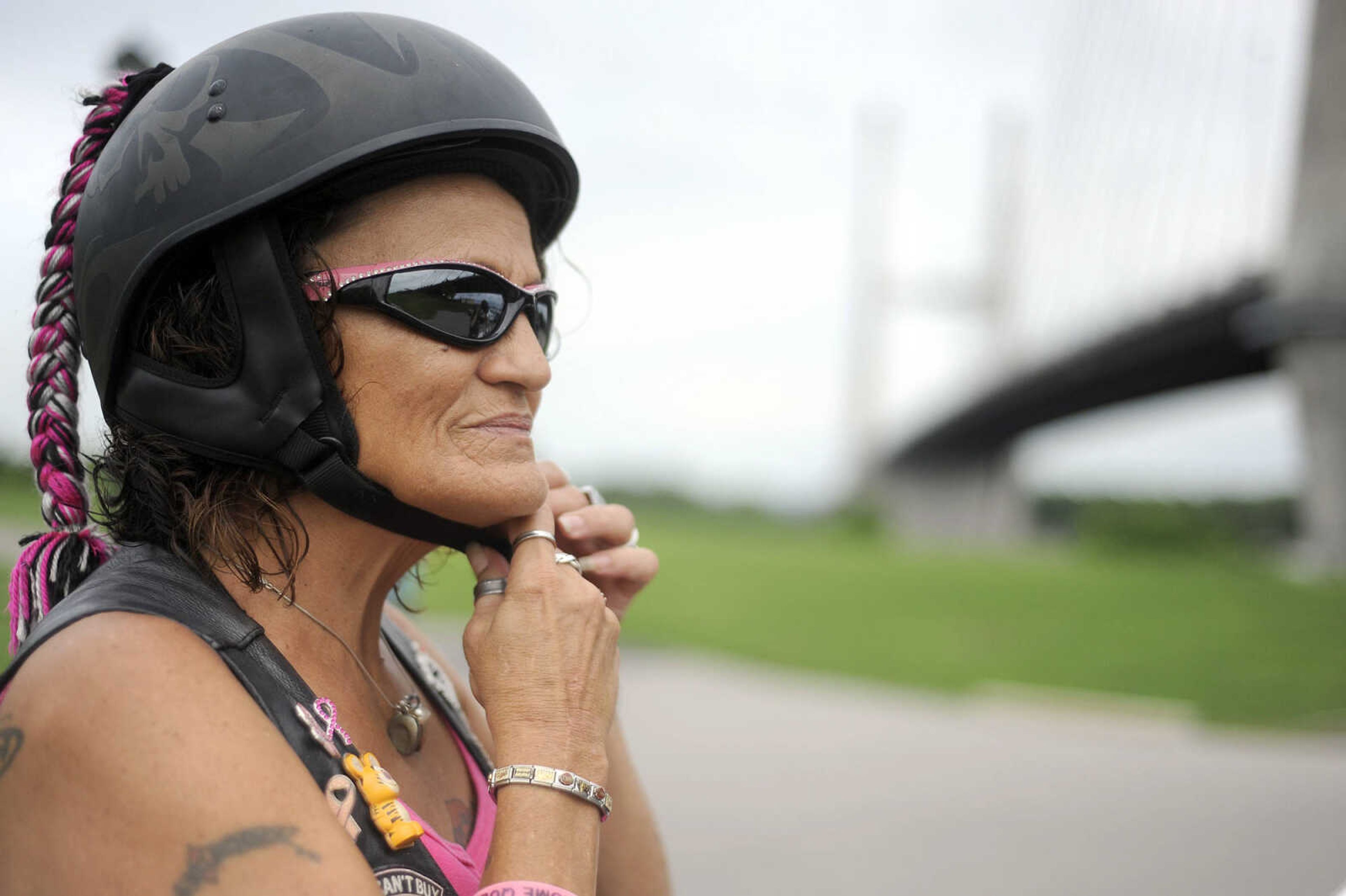 LAURA SIMON ~ lsimon@semissourian.com

Char "Tigger" Miller puts her helmut on before cruising down Aquamsi Street in Cape Girardeau on Thursday, Aug. 18, 2016.