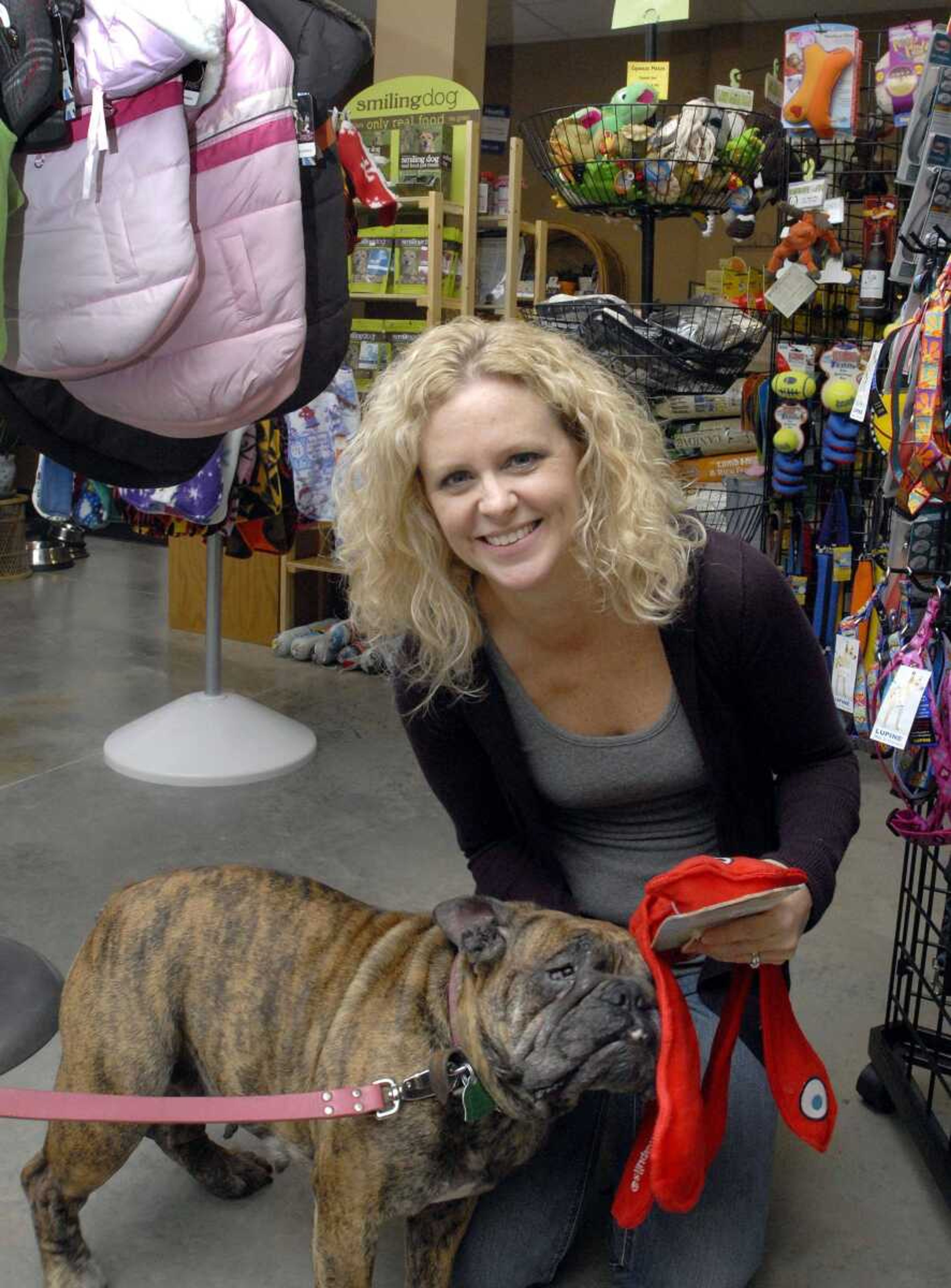 Busch Pet Products owner Stacy Busch-Heisserer and Wrinkles the bulldog. (Laura Simon)