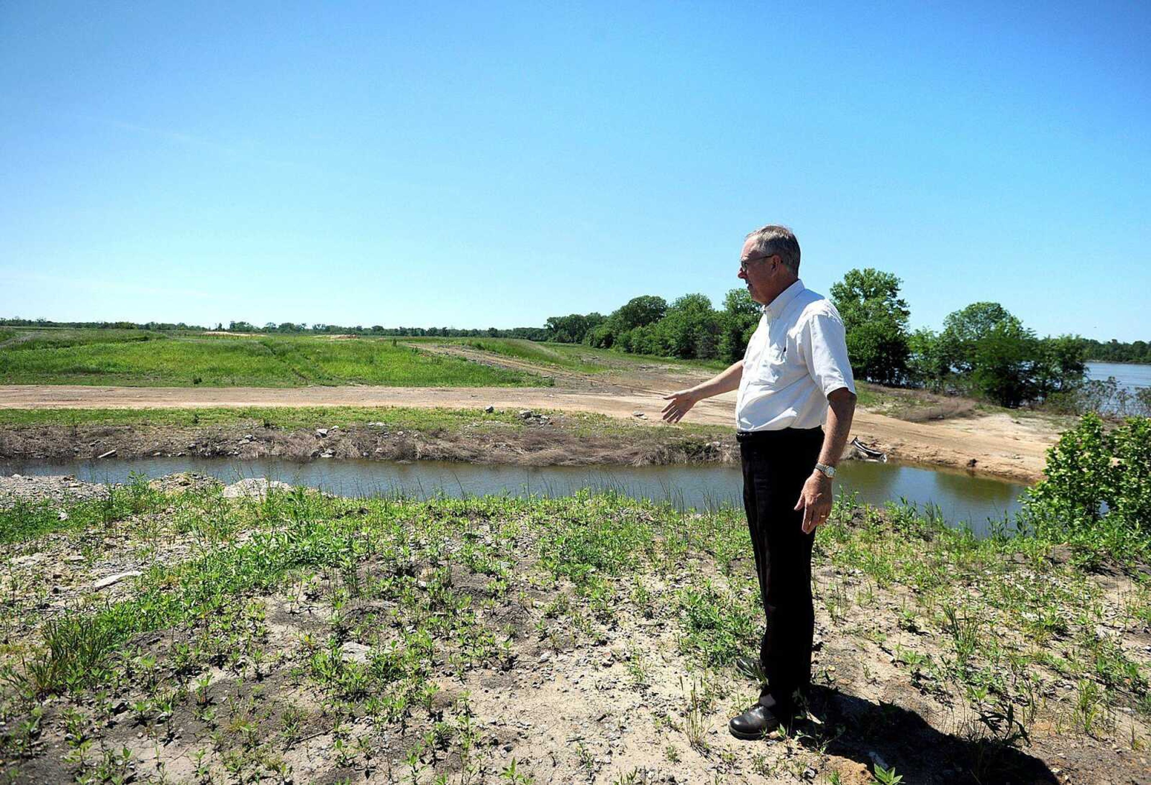 Dan Overbey, executive director of the Southeast Missouri Regional Port Authority, points out where it plans to fill a gap of land, extending River Road at the port. (Laura Simon)