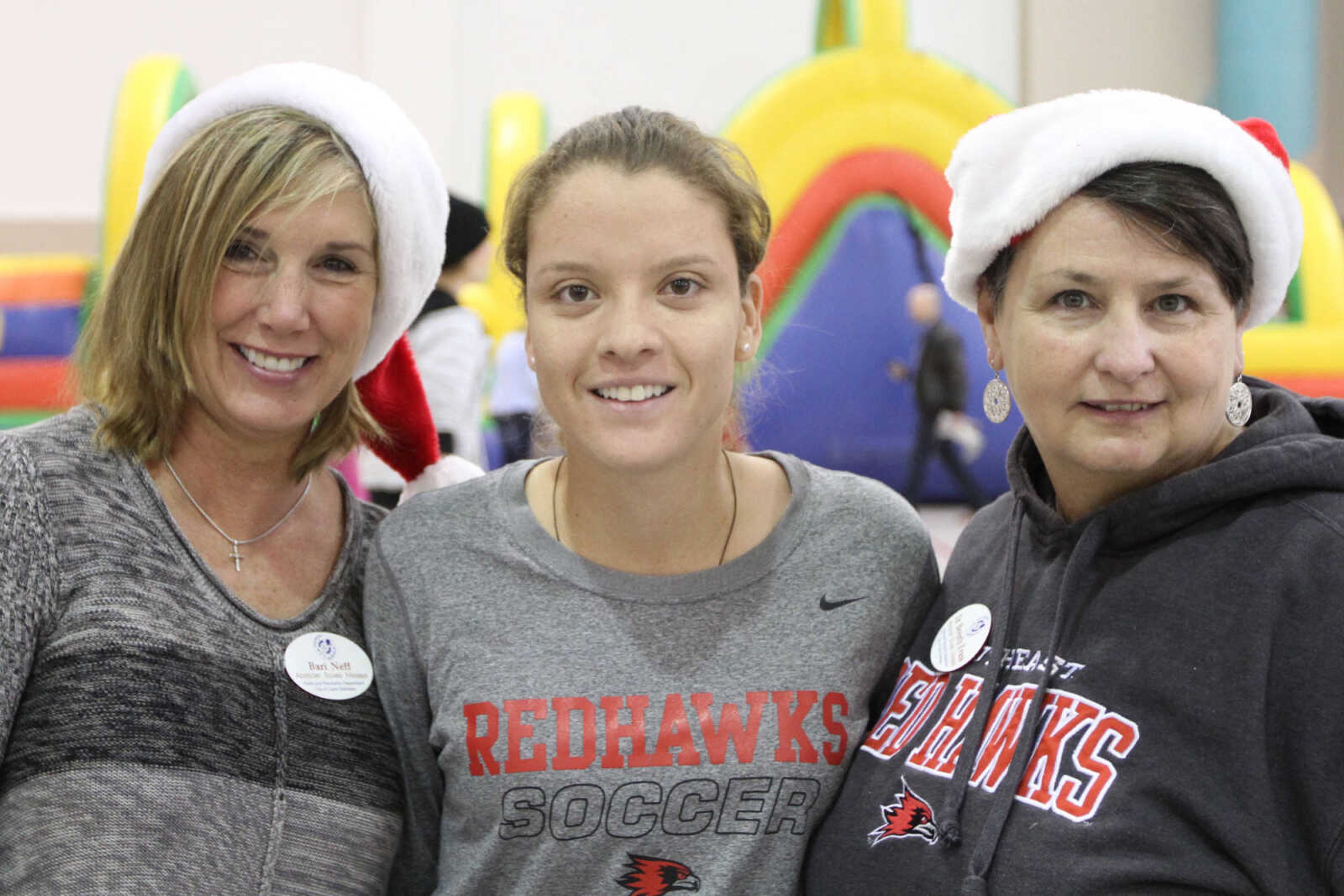 GLENN LANDBERG ~ glandberg@semissourian.com

Beri Neff, left, Valeria Jaramillo and Bev Evans pose for a photo during a breakfast with Santa fundraiser for the Cape Girardeau Parks and Recreation Foundation Saturday, Dec. 13, 2014 at the Osage Centre.