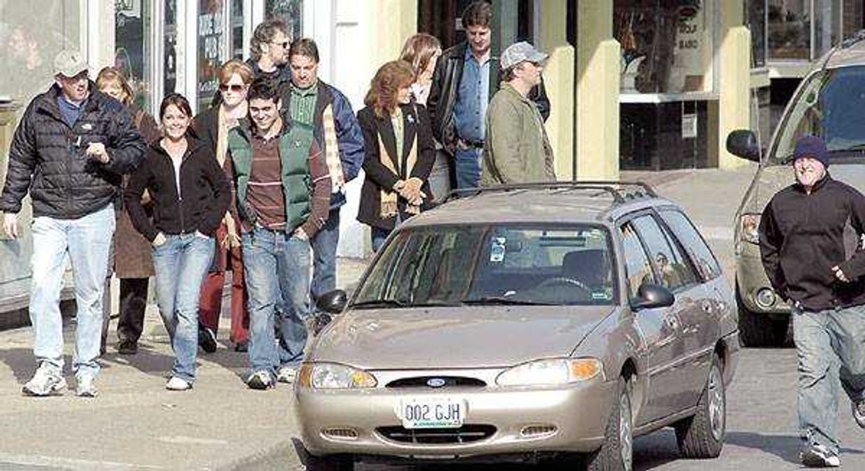 'Killshot' movie extras walked past Thomas Jane along Main Street as they got ready to play their parts during the filming of the movie in downtown Cape Girardeau.