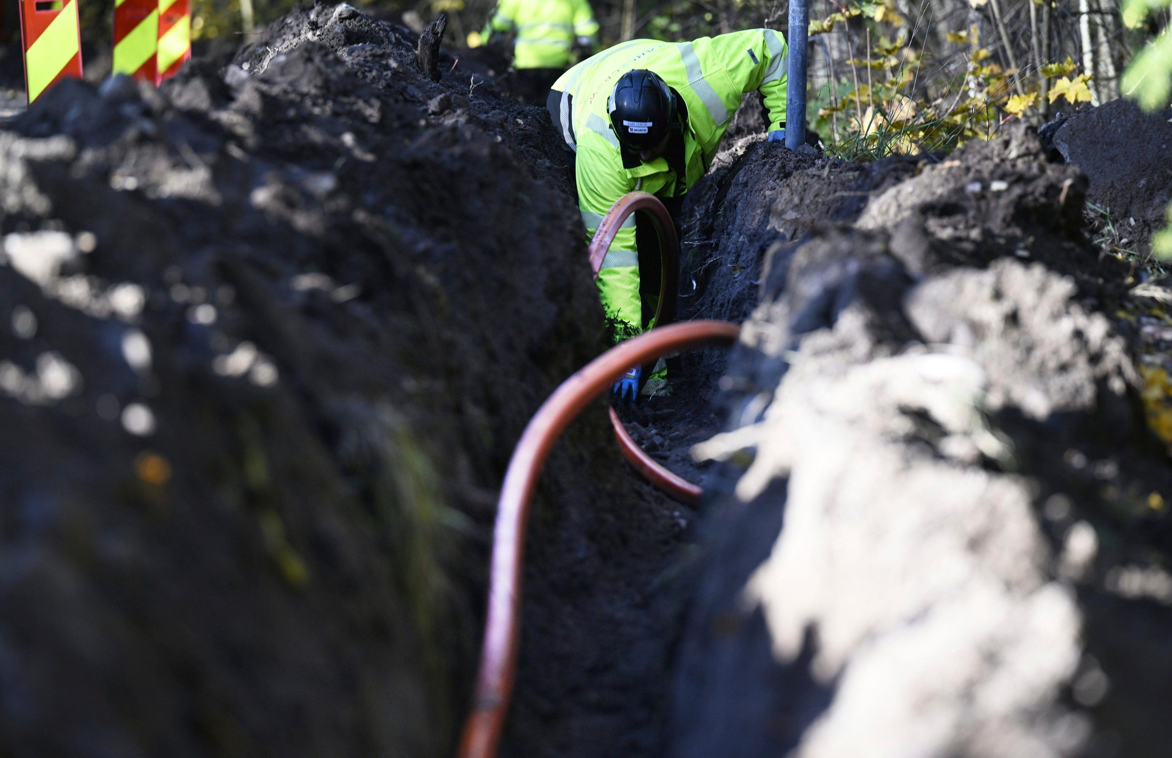 FILE - An optical fibre cable of the Swedish digital infrastructure provider GlobalConnect is being laid underground in Espoo, Finland, Wednesday, Oct. 16, 2024. (Vesa Moilanen/Lehtikuva via AP, File)