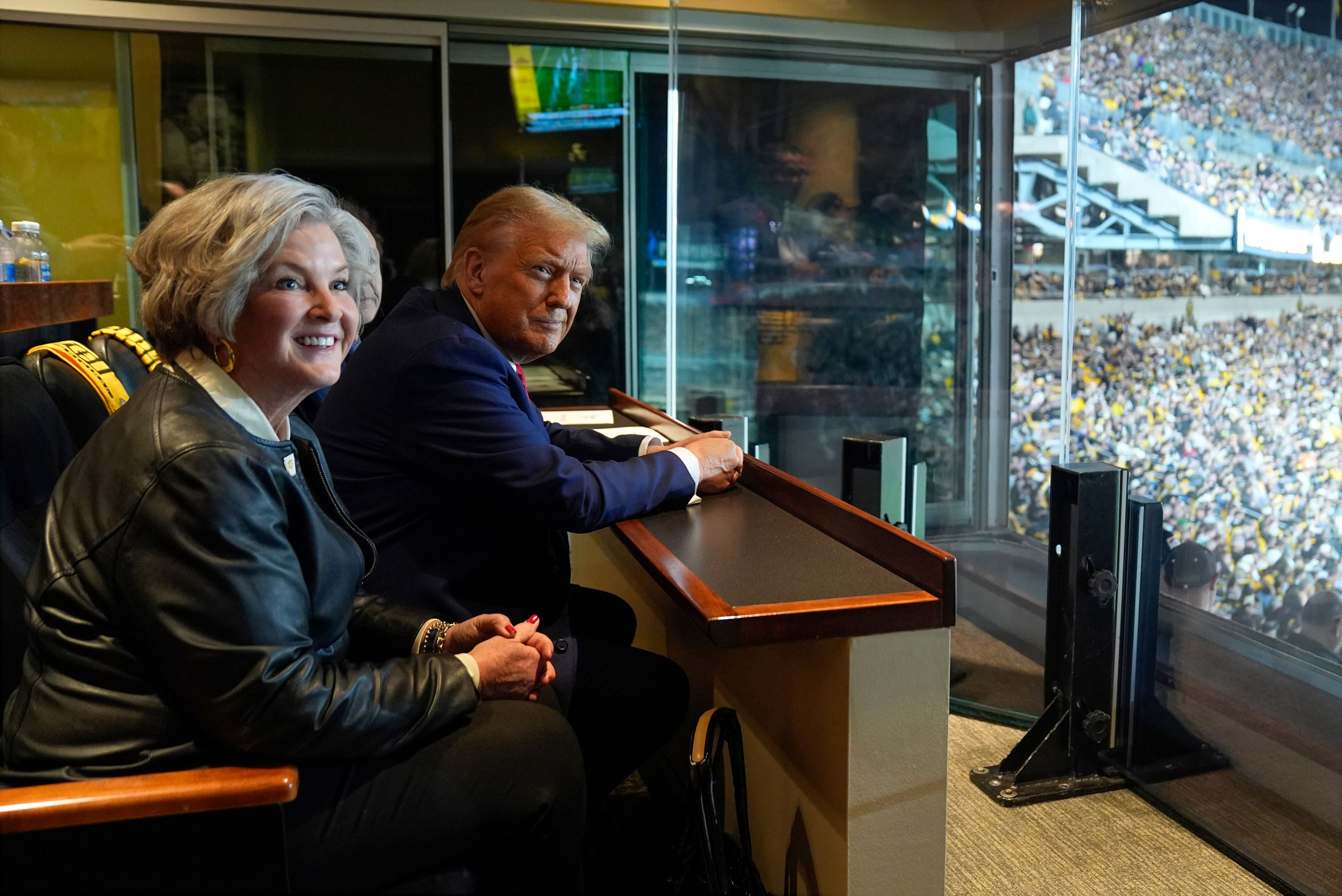 FILE - Republican presidential nominee former President Donald Trump sits with Susie Wiles as he attends the New York Jets football game against the Pittsburgh Steelers at Acrisure Stadium, Oct. 20, 2024, in Pittsburgh. (AP Photo/Evan Vucci, File)