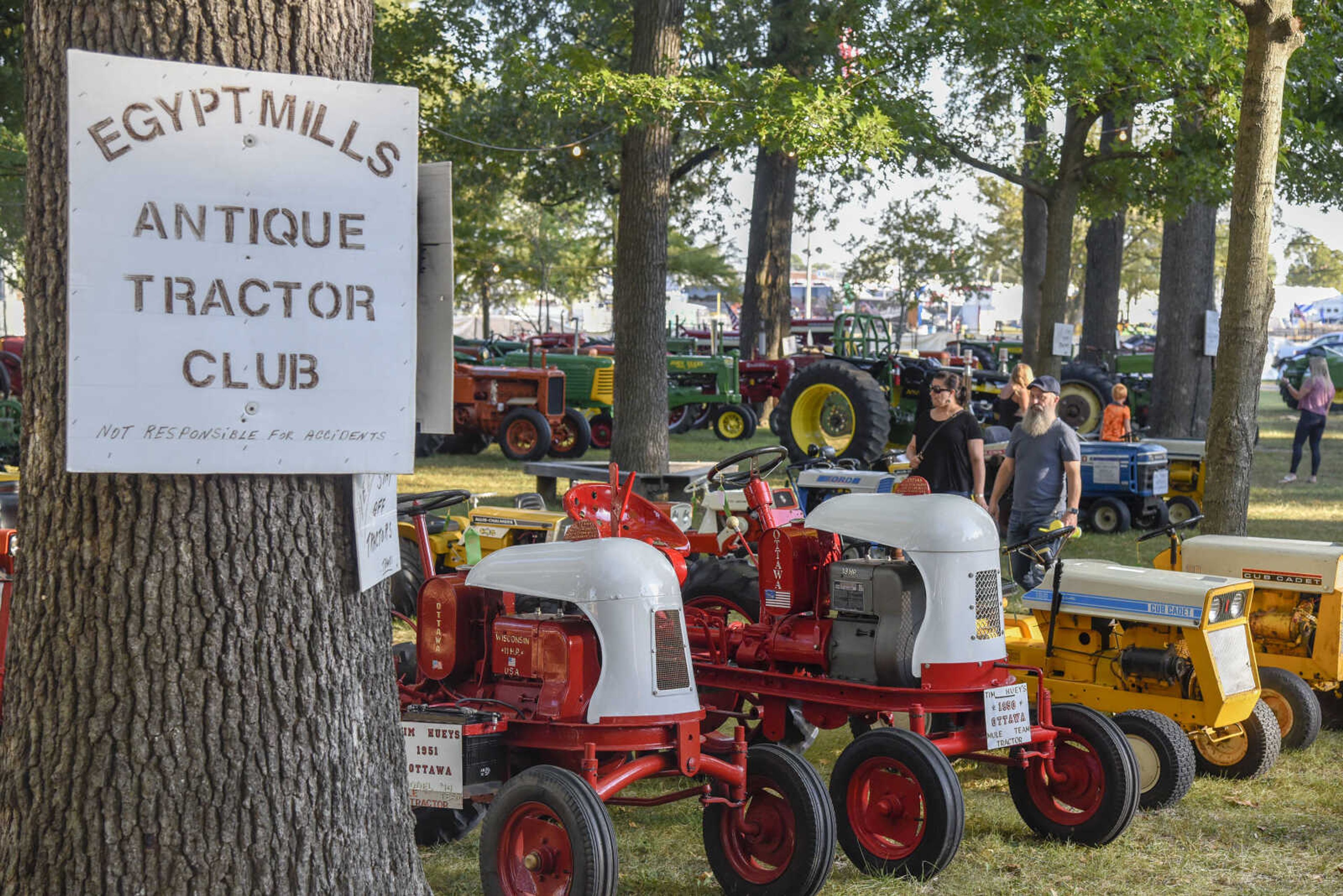 Attendees tour the Egypt Mills Antique Tractor Club display during the SEMO District Fair Wednesday, Sept. 15, 2021 in Cape Girardeau.