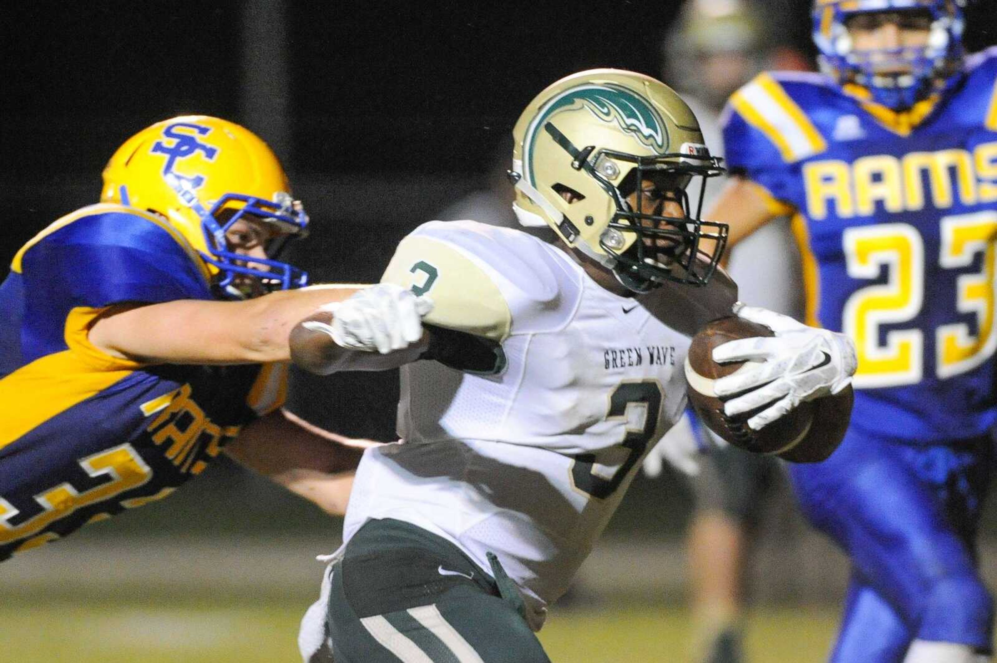 Malden's Kylus Thompson shakes off a tackle from Scott City's Braden Cox in the second quarter Friday, Sept. 11, 2015 in Scott City. (Glenn Landberg)