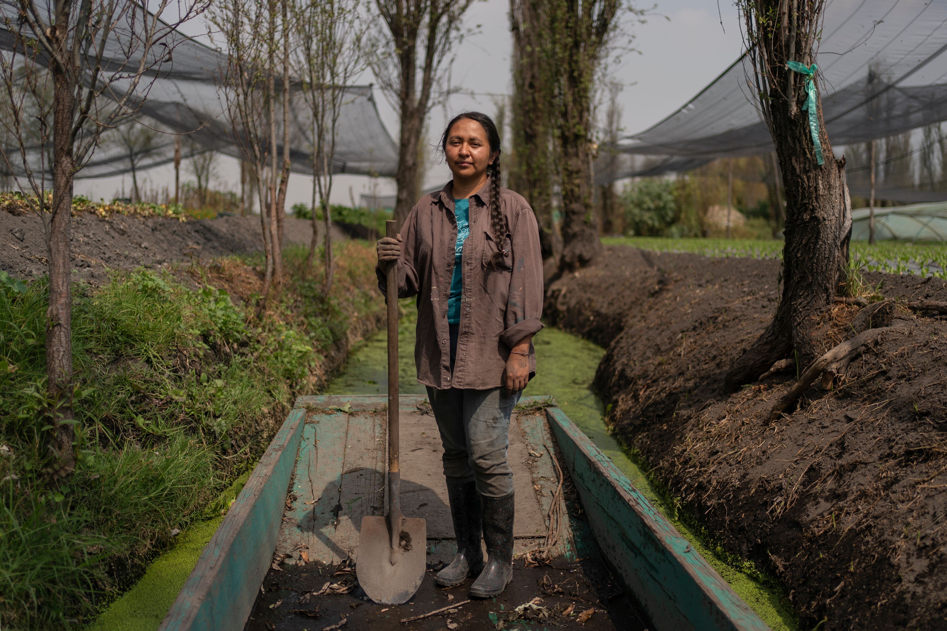 Cassandra Garduno poses for a portrait at her floating garden in the Xochimilco borough of Mexico City, Tuesday, Oct. 29, 2024. (AP Photo/Felix Marquez)