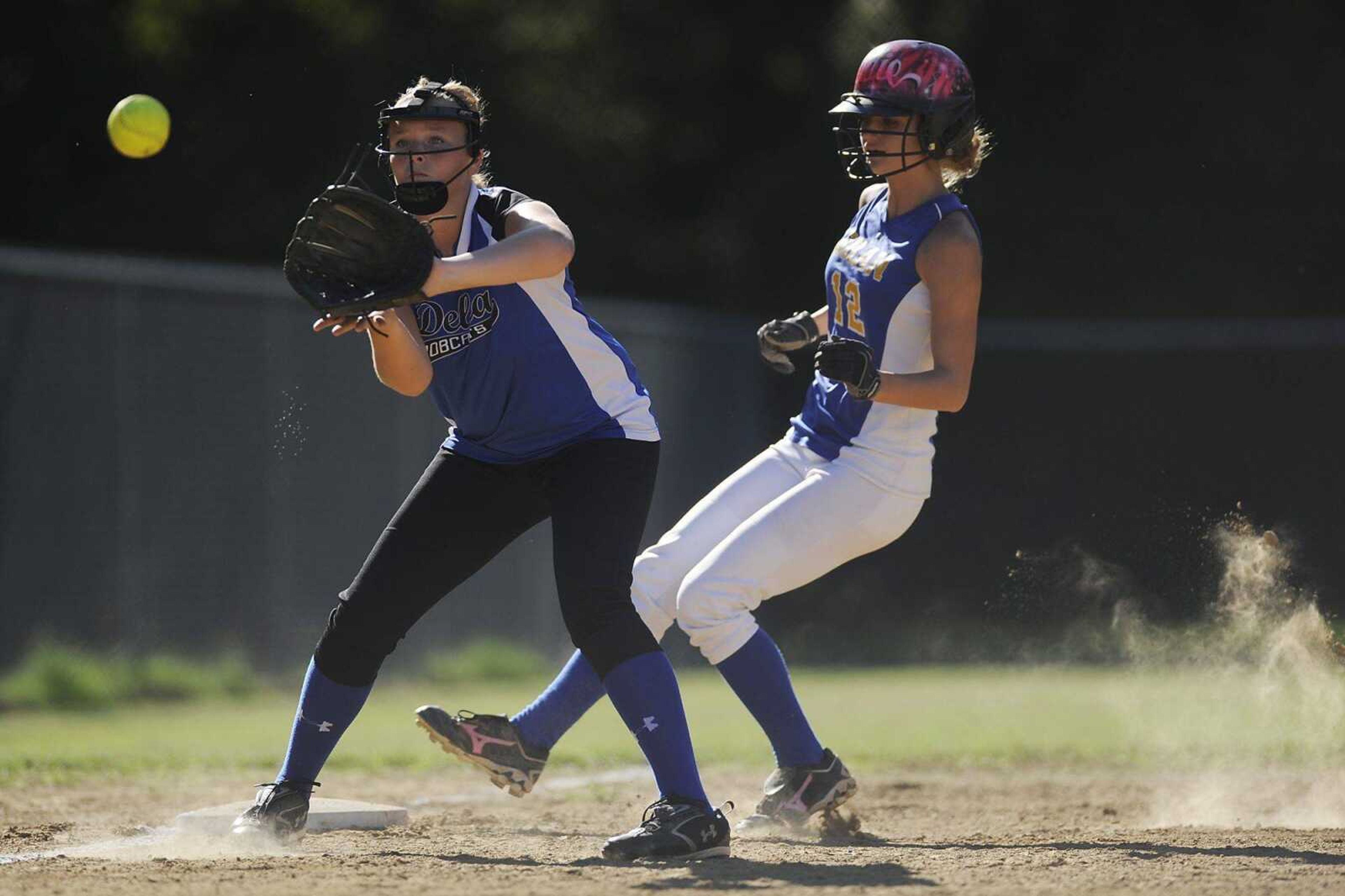 Oran&#8217;s Addie Kielhofner steals third ahead of the throw to Delta&#8217;s Jenna Henson Wednesday. (ADAM VOGLER)