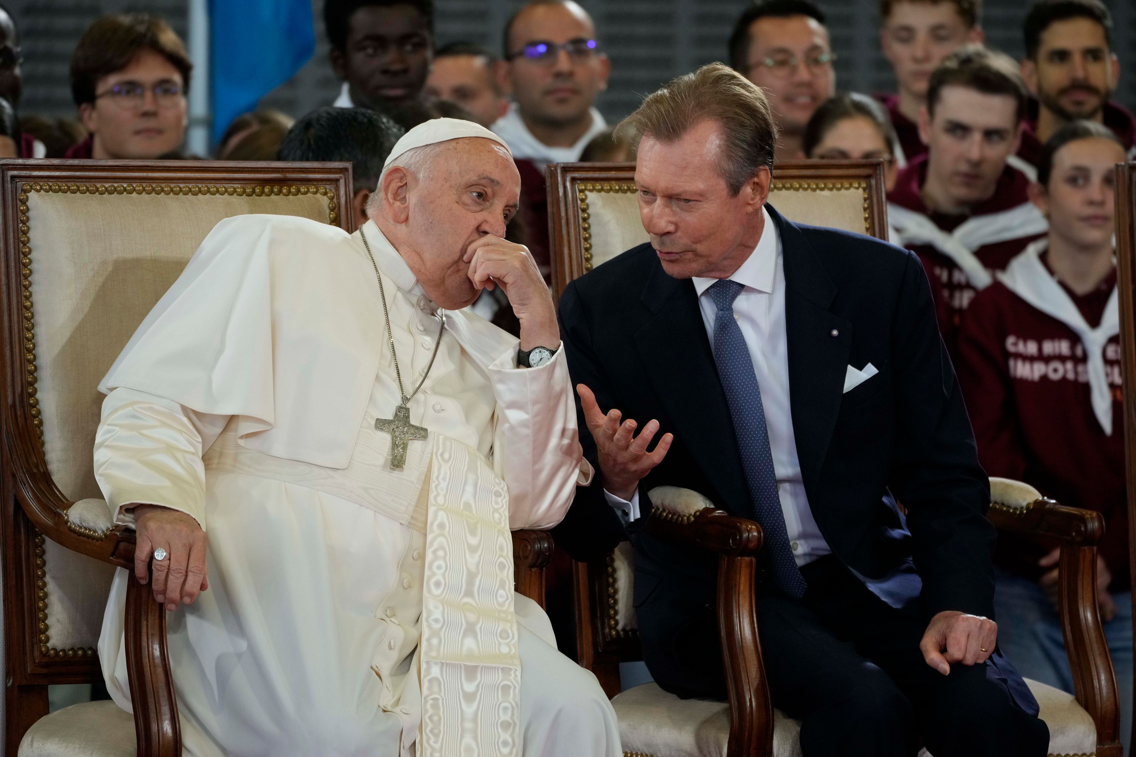 Pope Francis listens to Luxembourg's Grand Duke Henri upon his arrival at Findel International Airport in Luxembourg, Thursday, Sept. 26, 2024. (AP Photo/Andrew Medichini)