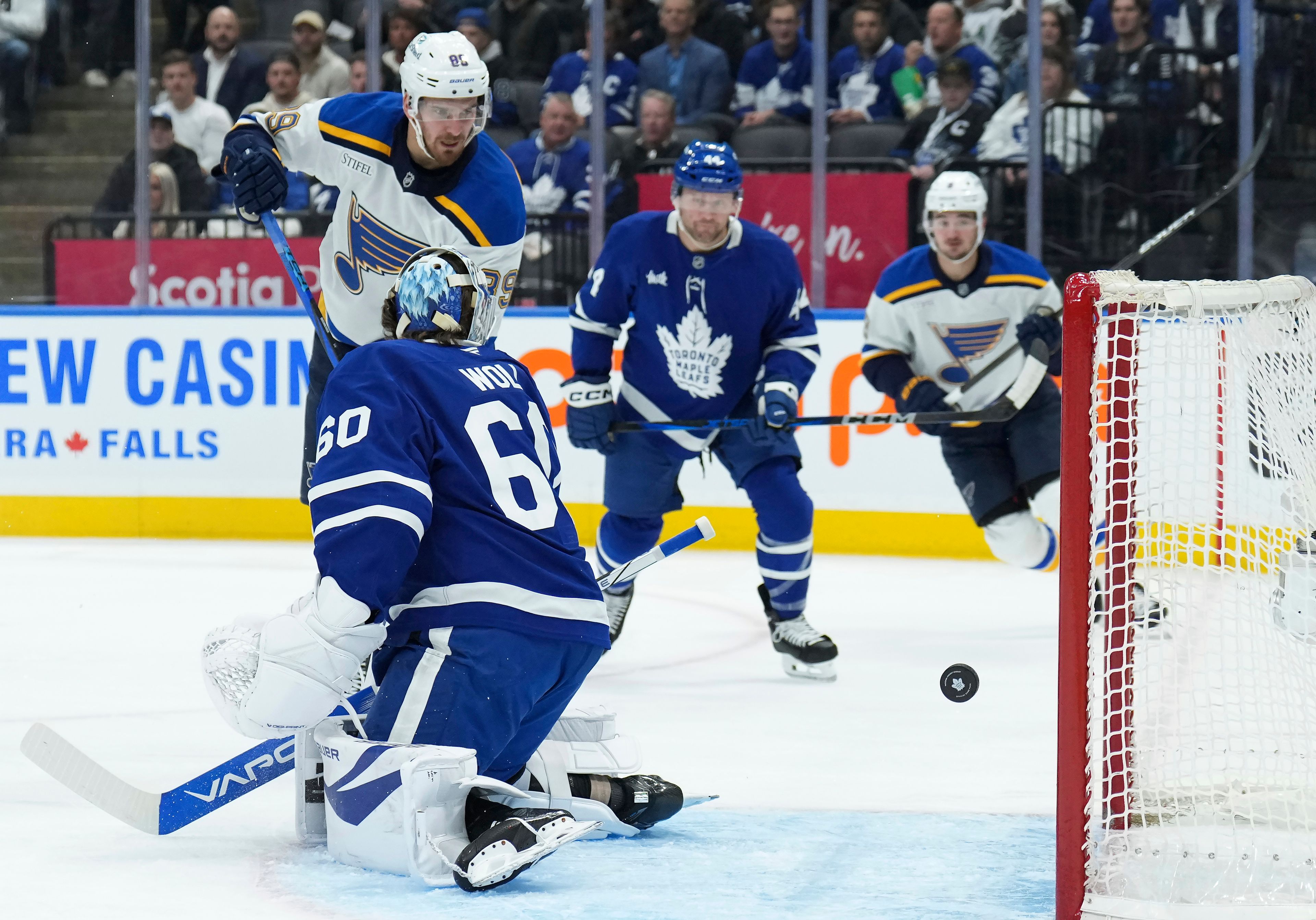 St. Louis Blues forward Pavel Buchnevich (89) watches the puck pass Toronto Maple Leafs goaltender Joseph Woll (60) during the first period of an NHL hockey game in Toronto, Thursday, Oct. 24, 2024. (Nathan Denette/The Canadian Press via AP)