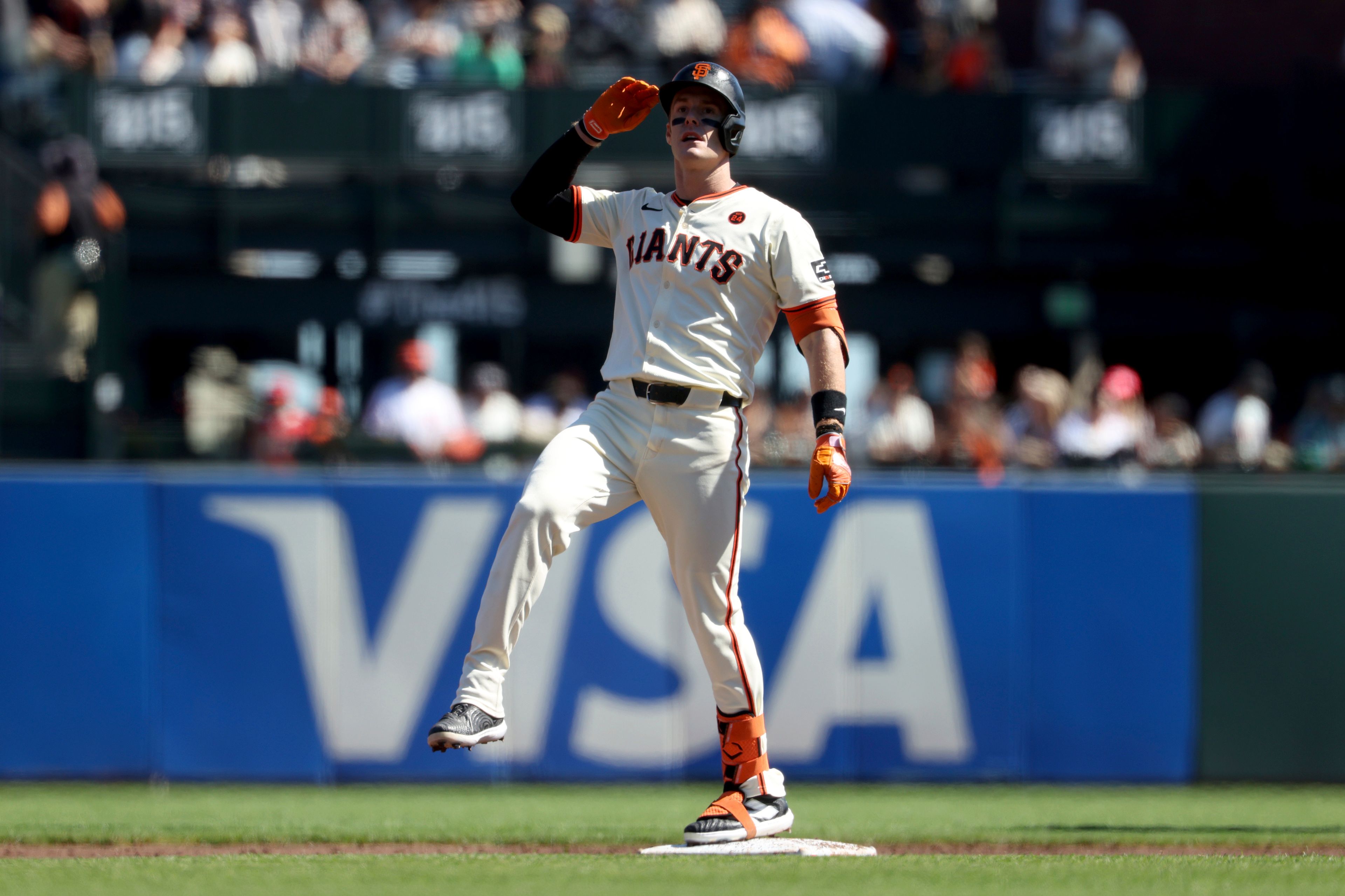 San Francisco Giants' Mark Canha celebrates after hitting a double during the first inning of a baseball game against the St. Louis Cardinals in San Francisco, Saturday, Sept. 28, 2024. (AP Photo/Jed Jacobsohn)