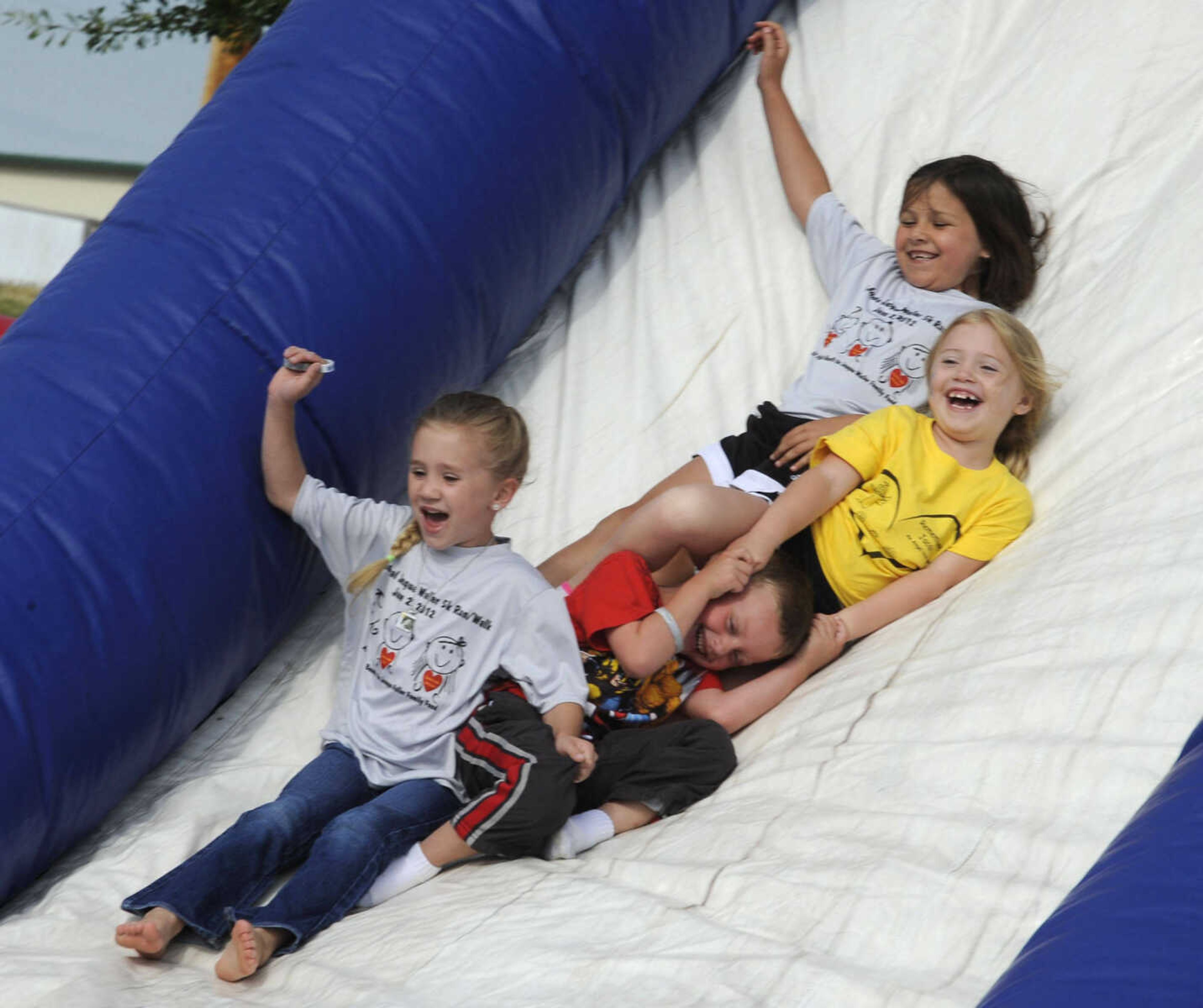 Children play on the slide before the race.