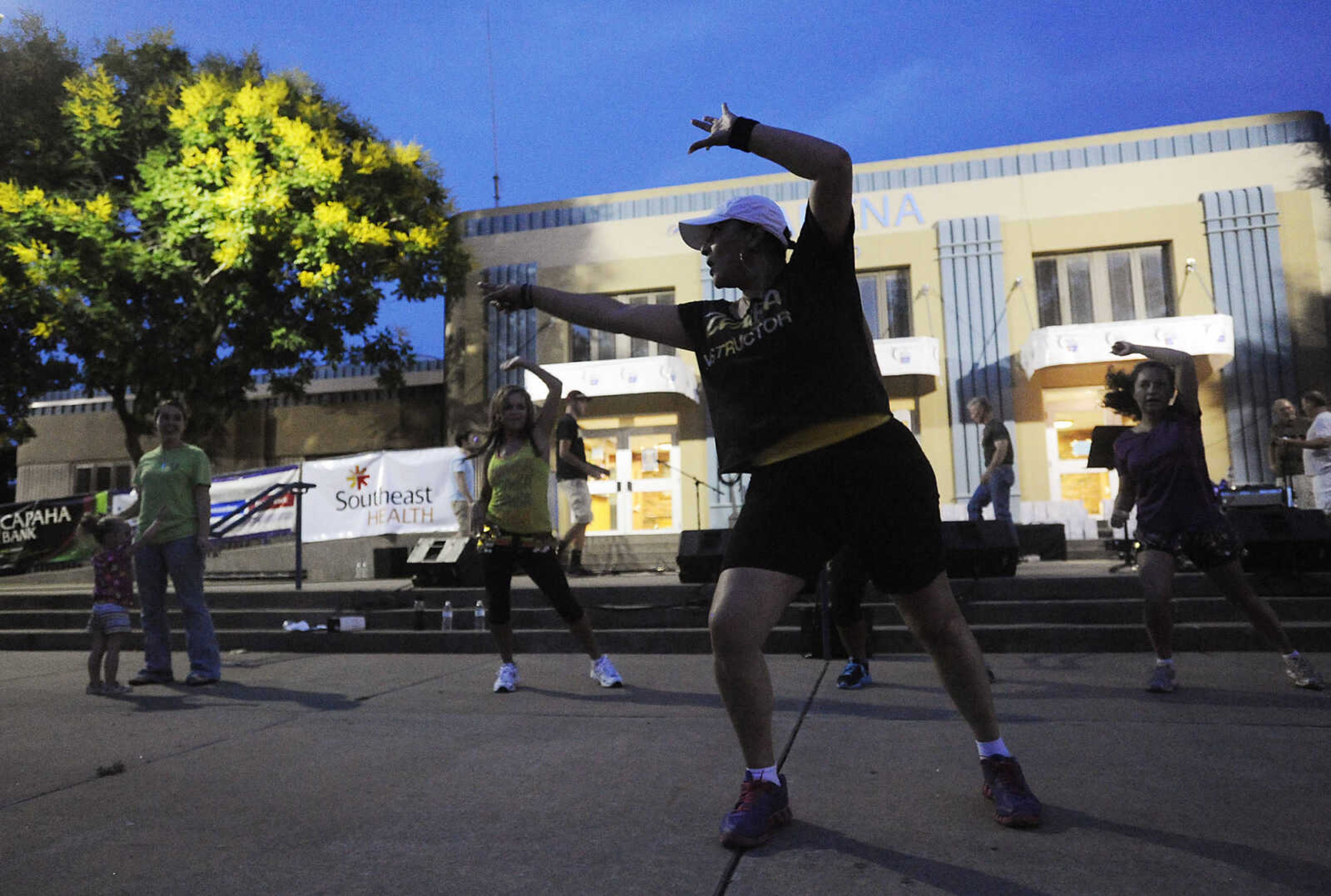 Marissa Higuera leads a Zumba class during the Relay for Life of Cape Girardeau County, Friday, June 14, at Arena Park in Cape Girardeau. This is the 15th year for the event, which serves to raise awareness about cancer while also serving as a fundraiser for the American Cancer Society. Participants form teams which raise money before and during the event.