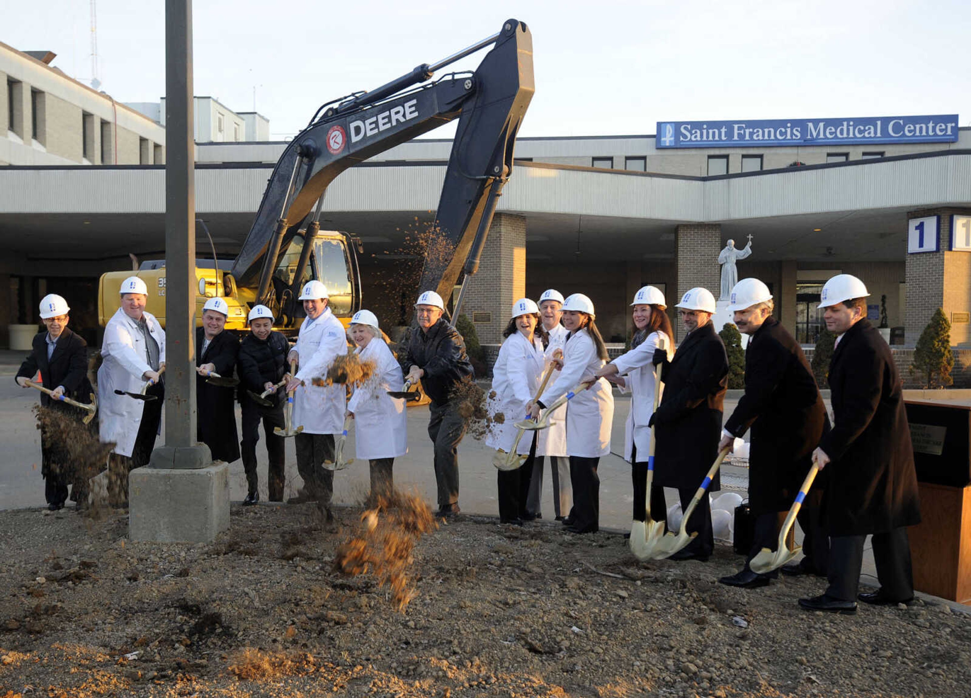 Ground is broken for the $127 million, two-phase "Building on Excellence" expansion and renovation project. From left: Marilyn Curtis, Vice President -- Professional Services, Dr. Matthew Schumer, family medicine physician; Dr. C. Edward LaValle III, infectious disease physician; Dr. Duc Nguyen, cardiologist; Dr. Andrew Godbey, neurologist; Dr. Deborah Price, internal medicine physician; Dr. Robert Gile, anesthesiologist; Dr. Carmen Keith, pain management physician; Dr. Clifford Talbert, cardiologist; Dr. Karlyle Christian-Ritter, neonatologist; Dr. Ann Behrend-Uhls, obstetrician/gynecologist; Dr. Brian Schafer, orthopedic surgeon; Steven C. Bjelich, President and CEO; Dennis Marchi, Chairman of the Saint Francis Healthcare System Board of Directors.