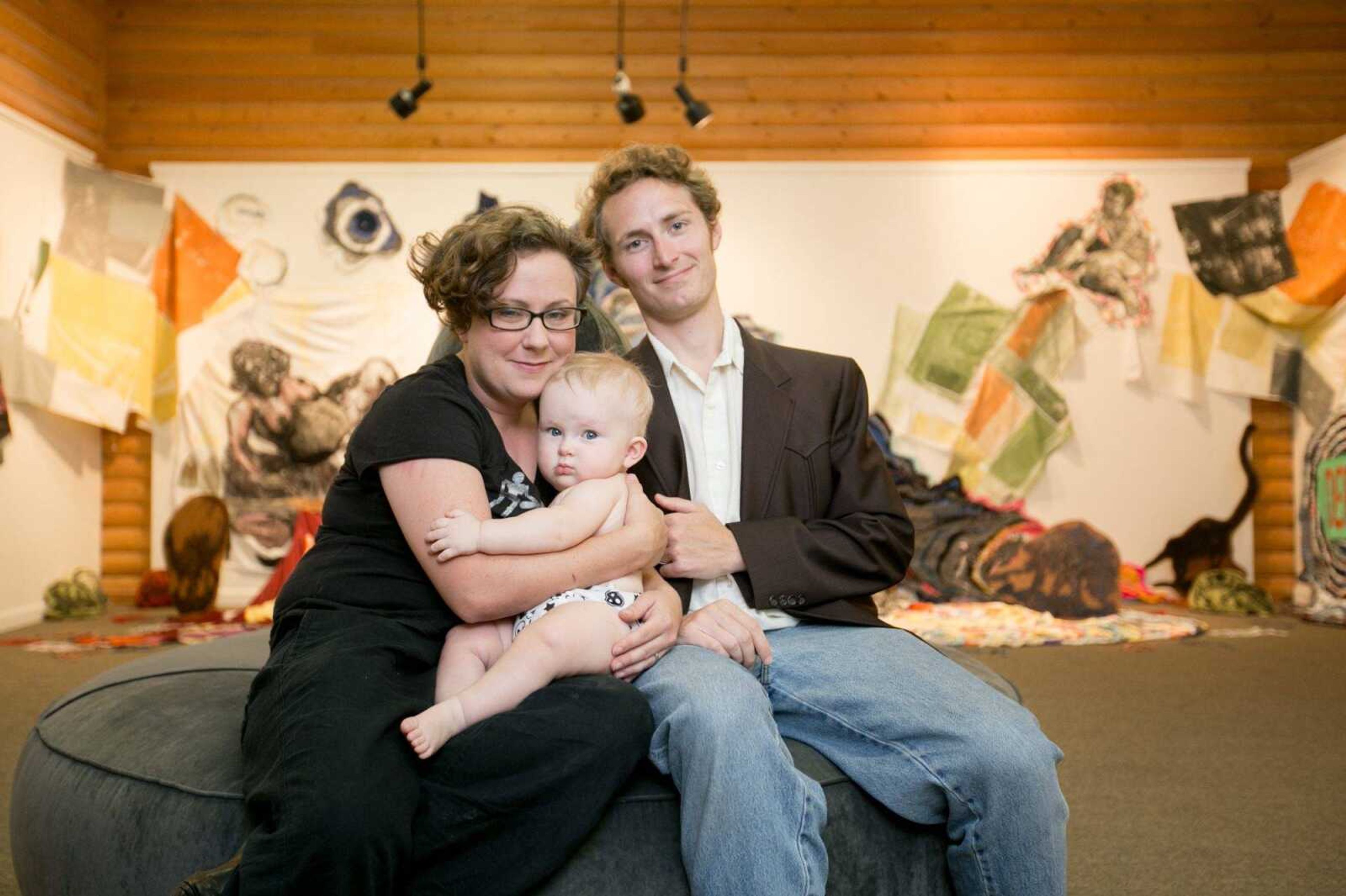 Blake and Hannah Sanders pose with their son, Levee, at the Arts Council of Southeast Missouri, where their exhibit is on display. (Glenn Landberg)