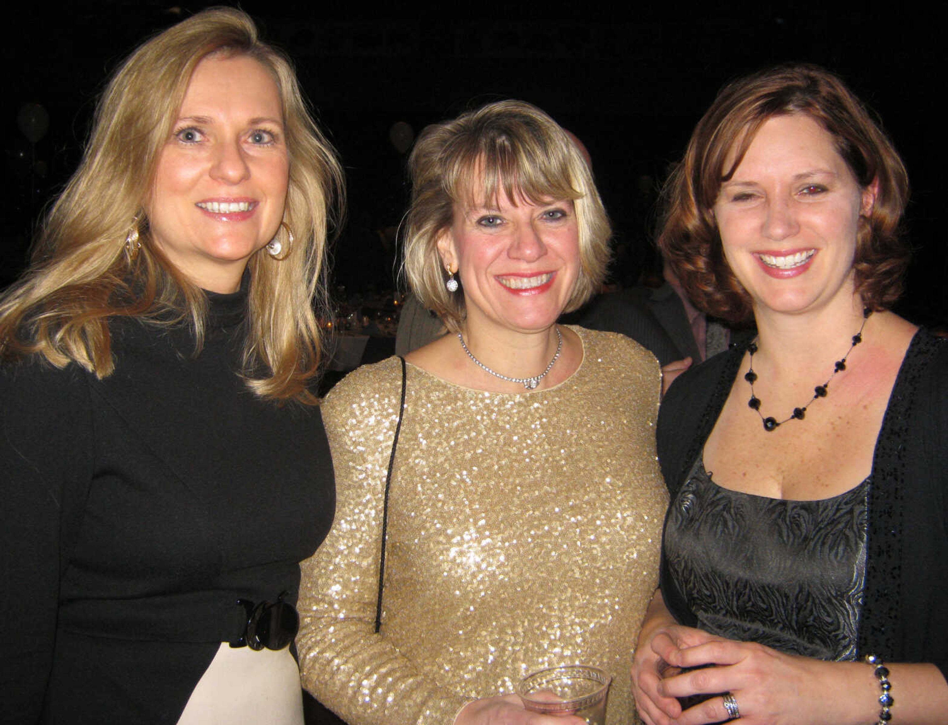 Linda Greaser, left, Proctor & Gamble; Lois Forde-Kohler, Proctor & Gamble; and Amy Spencer, Proctor & Gamble, pose at the Cape Girardeau Area Chamber of Commerce annual banquet Friday, Jan. 27 at the Show Me Center.