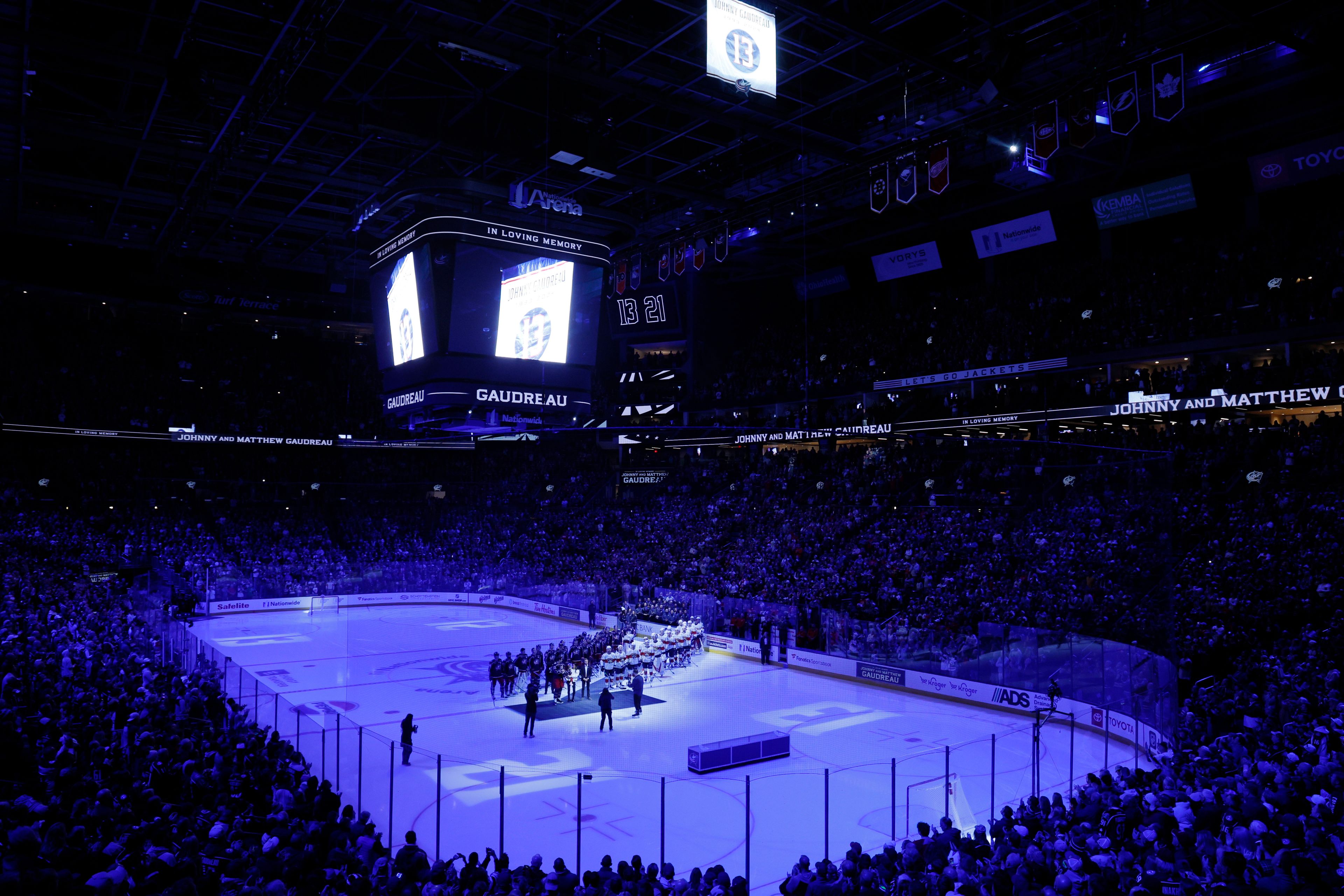 Blue Jackets' Johnny Gaudreau's family watches a #13 banner being raised during a ceremony before the start of an NHL hockey game between the Columbus Blue Jackets and the Florida Panthers. Tuesday, Oct. 15, 2024, in Columbus, Ohio. (AP Photo/Jay LaPrete)