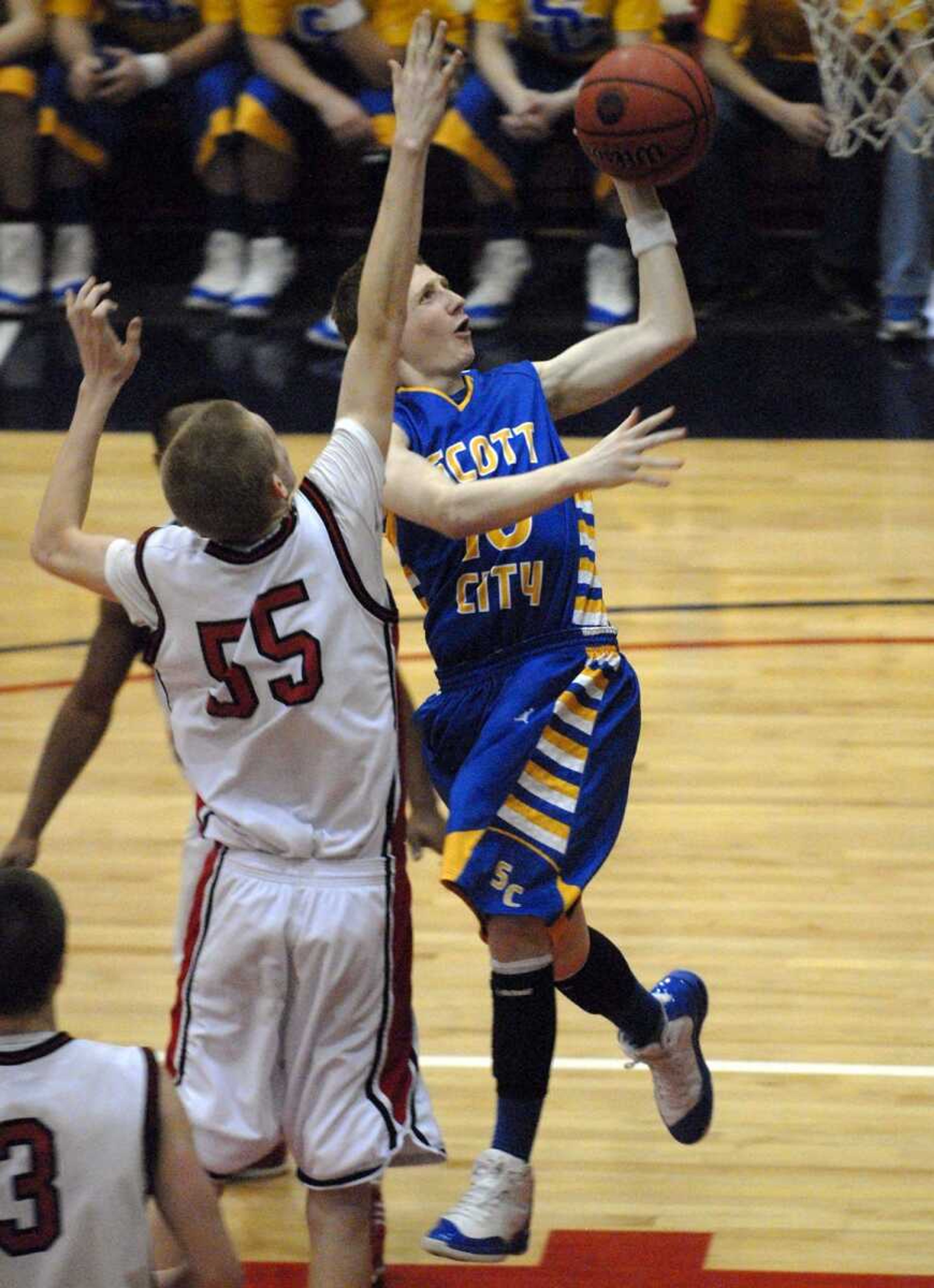 Scott City's Jesse Sanders takes a shot around Crystal City's Bryan Degeare during the fourth quarter of their Class 3 sectional Wednesday in Hillsboro, Mo. (Laura Simon)