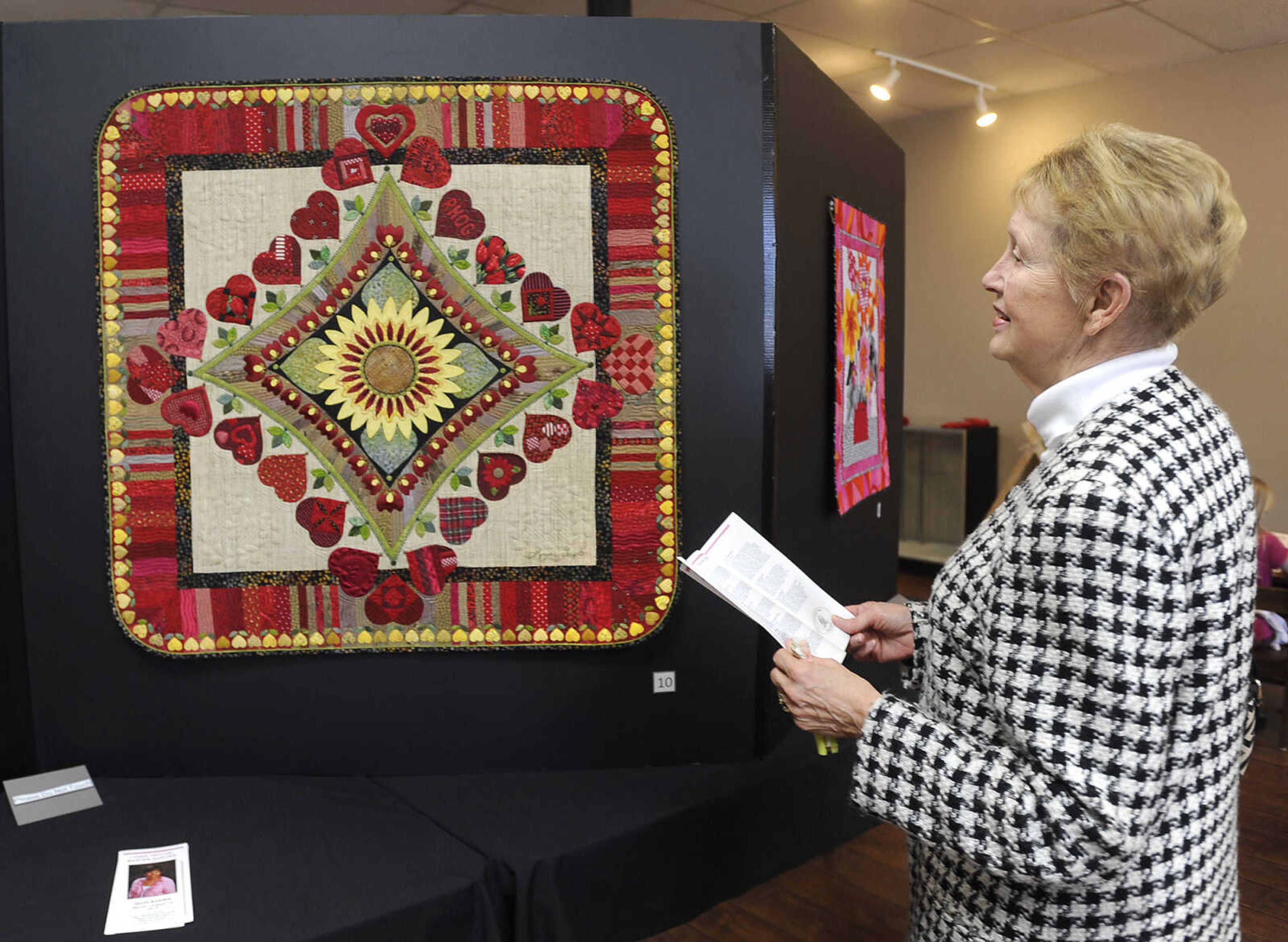 FRED LYNCH ~ flynch@semissourian.com
Jackson mayor Barbara Lohr tours a quilt exhibit by Lynne Taylor on Sunday, March 15, 2015 at the Cape Girardeau County History Center in Jackson. The display will continue through June 15.