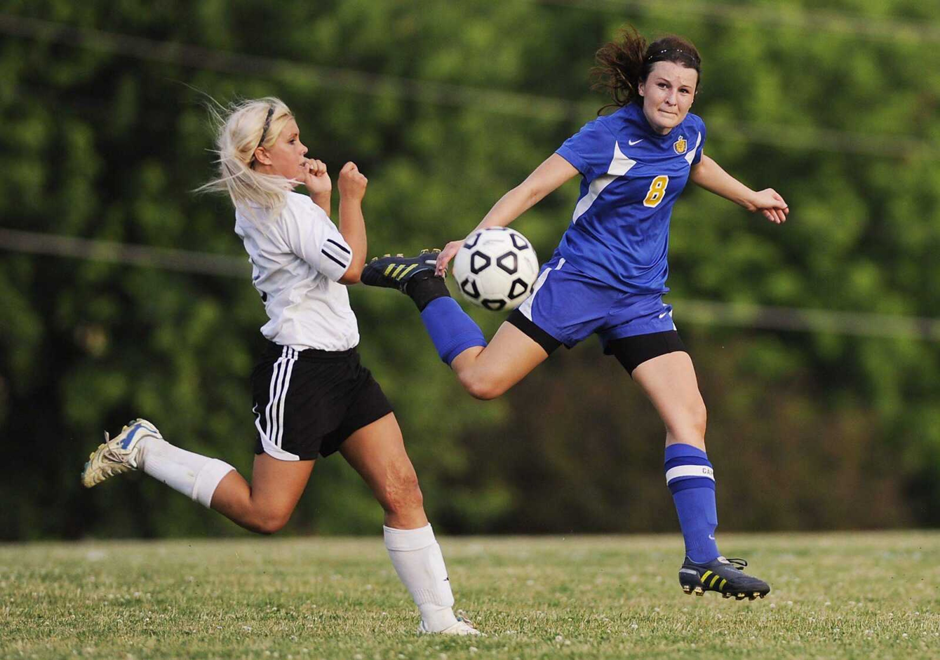 St. Vincent's Storm French clears the ball past Jackson's Jordan Myer during their game in May at Jackson. (ADAM VOGLER)